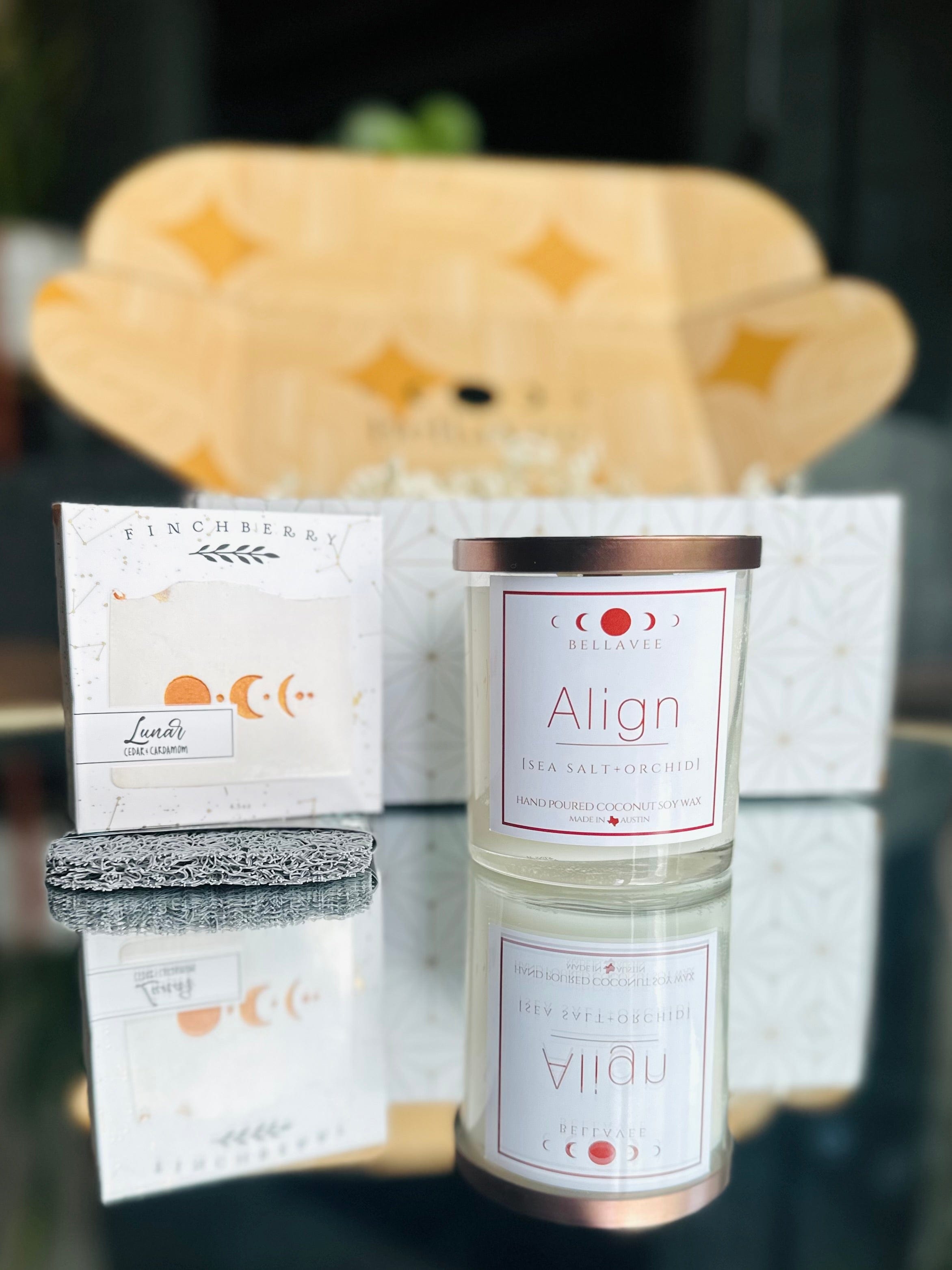 Welcome Home gift set includes a crystal candle, palo santo bundle, lunar soap, and soap saver, all beautifully packaged for serenity