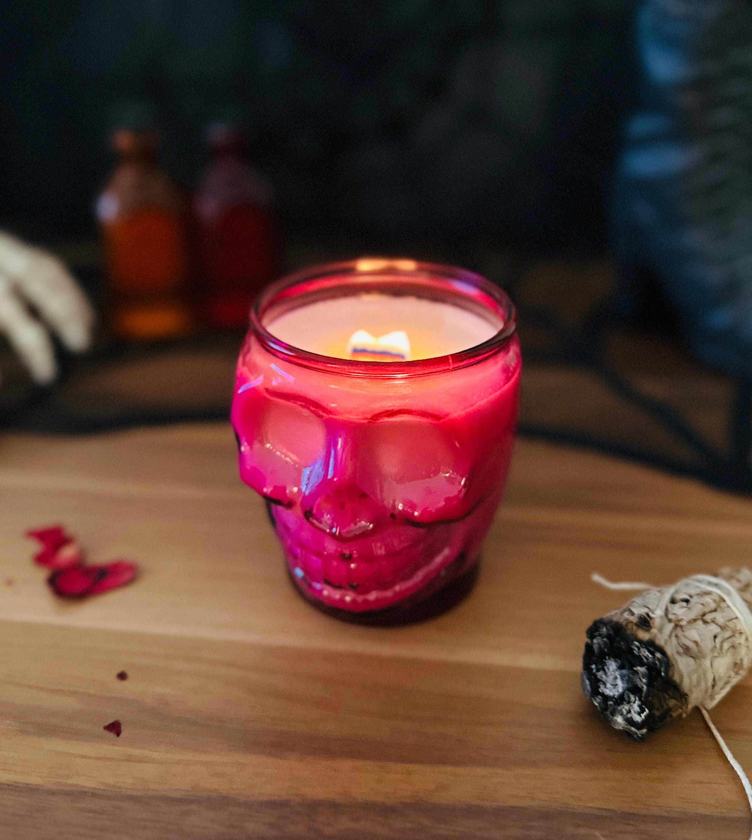 Lit pink skull candle with spooky Halloween vibes