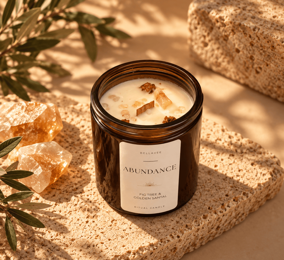 ABUNDANCE Citrine crystal candle with wooden wick and botanical details in an amber glass vessel