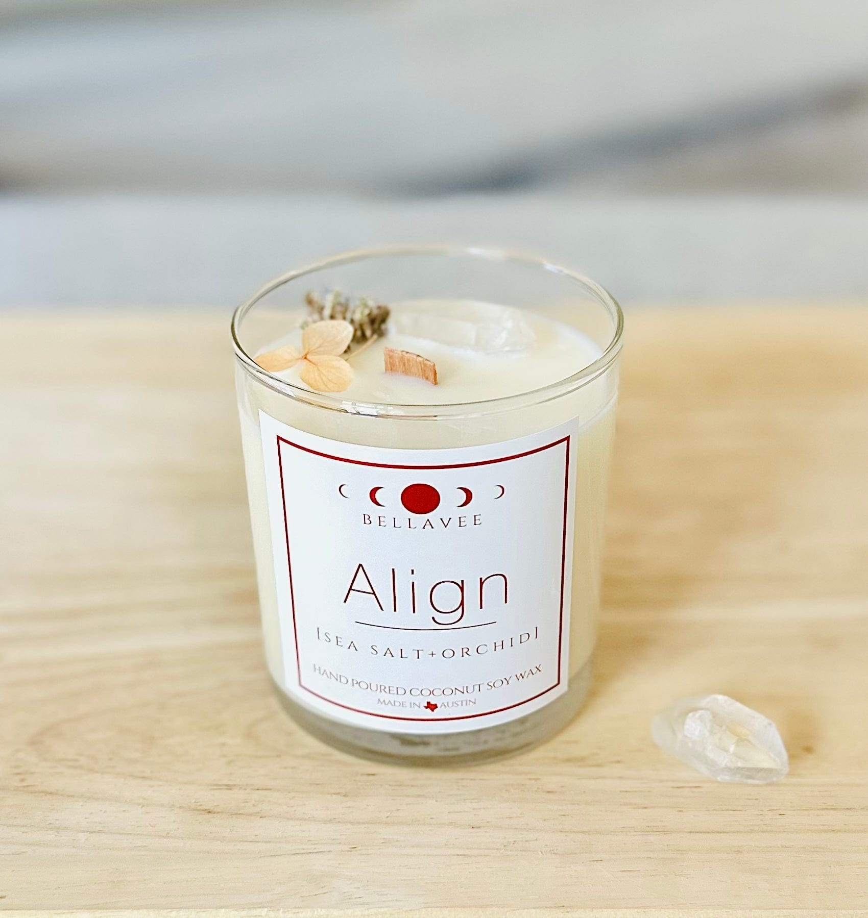 Align clear quart crystal candle hero shot with dried botanicals and wooded wick