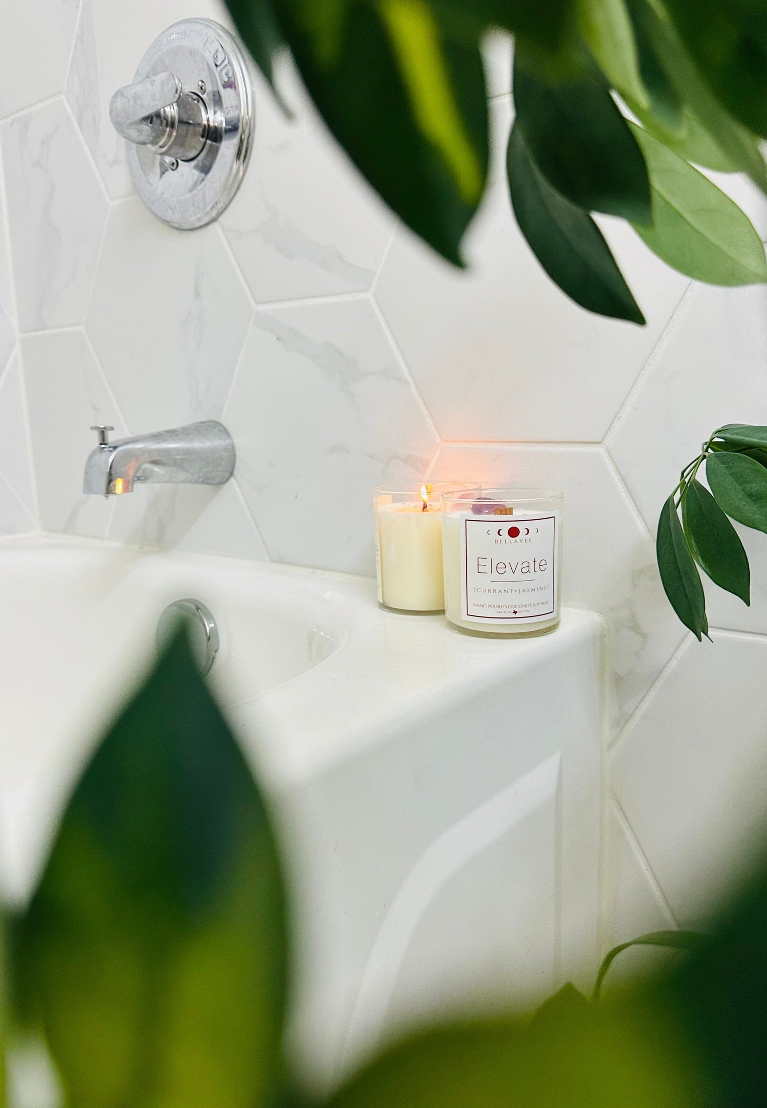 elevate amethyst crystal candle, lit with calming black currant and jasmine, enhances well-being and serenity
