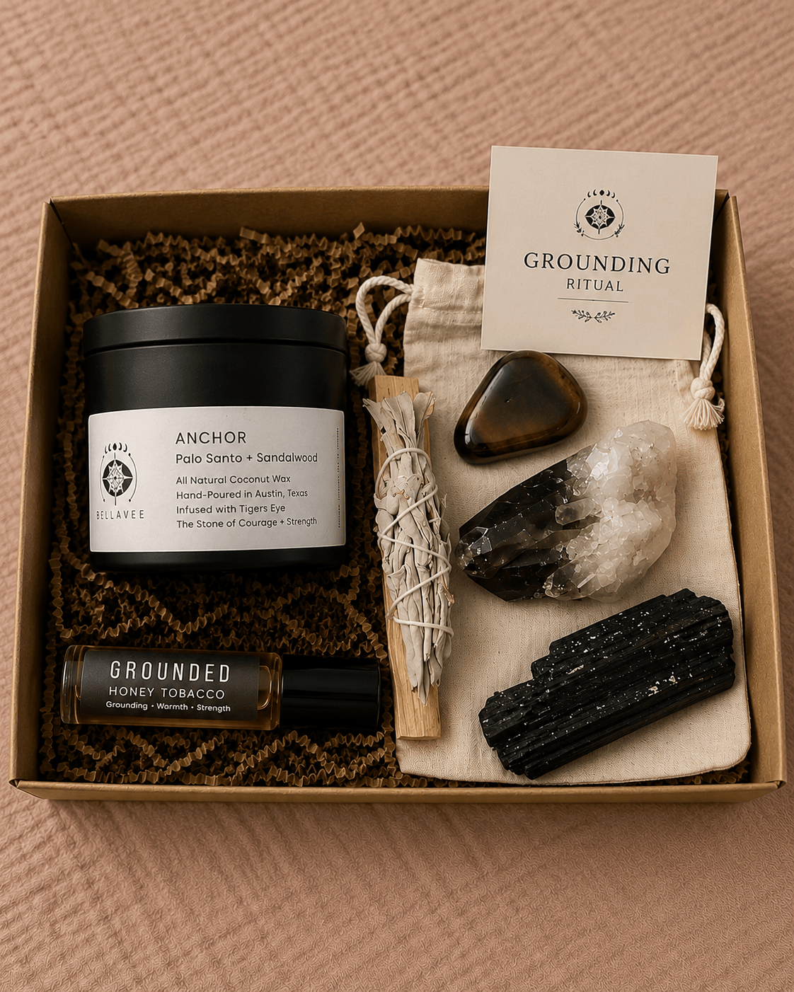 Grounding Ritual Kit with Anchor candle, grounding crystals, sage, palo santo, perfume oil, and cotton pouch in a kraft gift box.