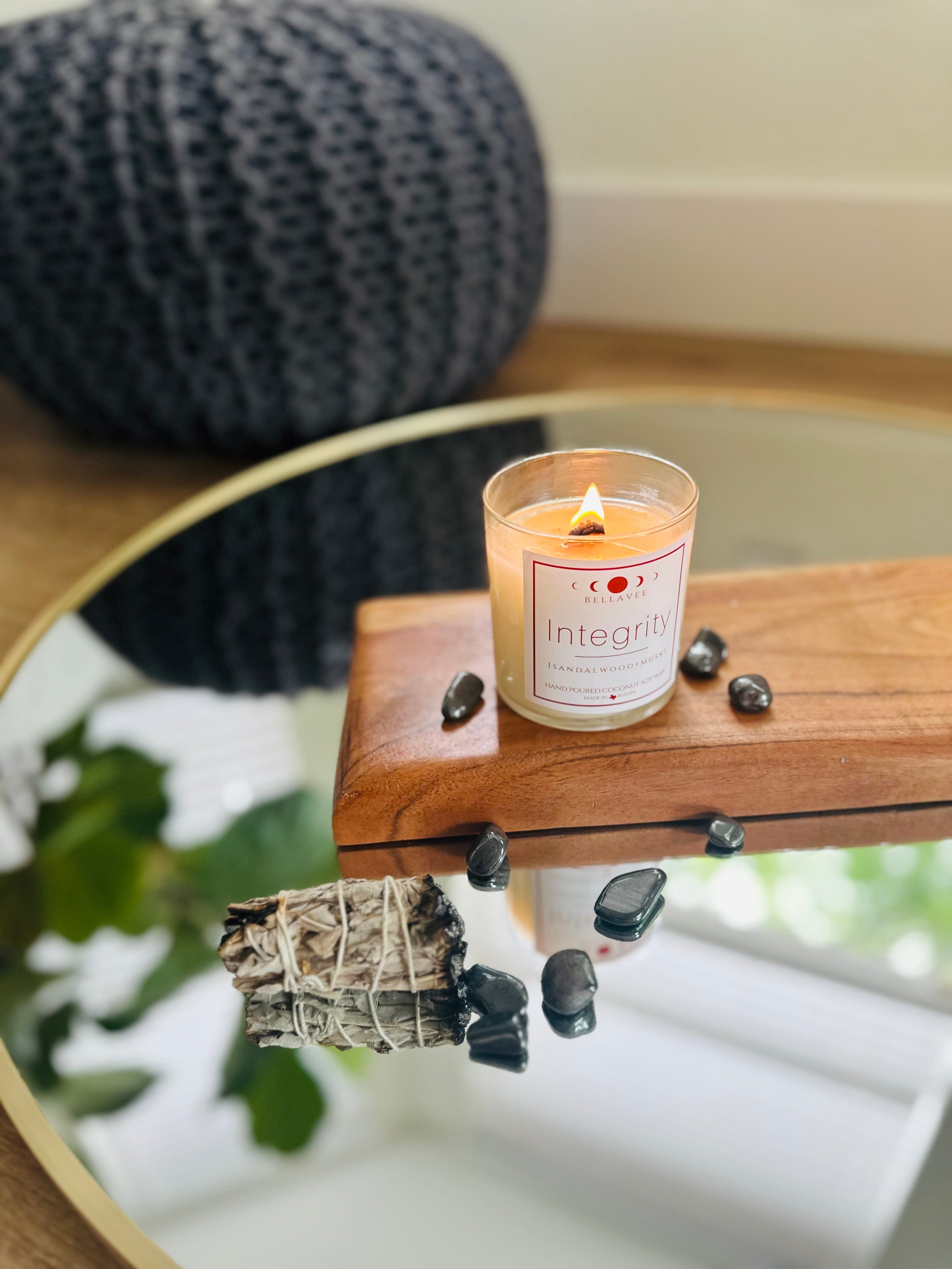 Lighten up the Integrity Hematite Candle, enjoy grounding energy with aromas of sea salt, sandalwood, and dark musk