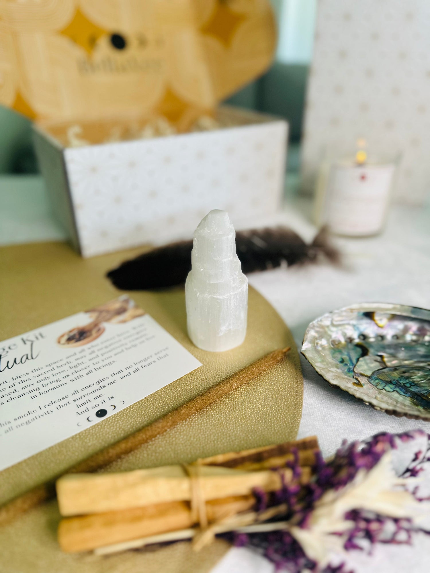 Complete Smudge Kit includes an abalone shell, selenite tower, feather, hand-rolled Palo Santo incense, and sage or Palo Santo bundle