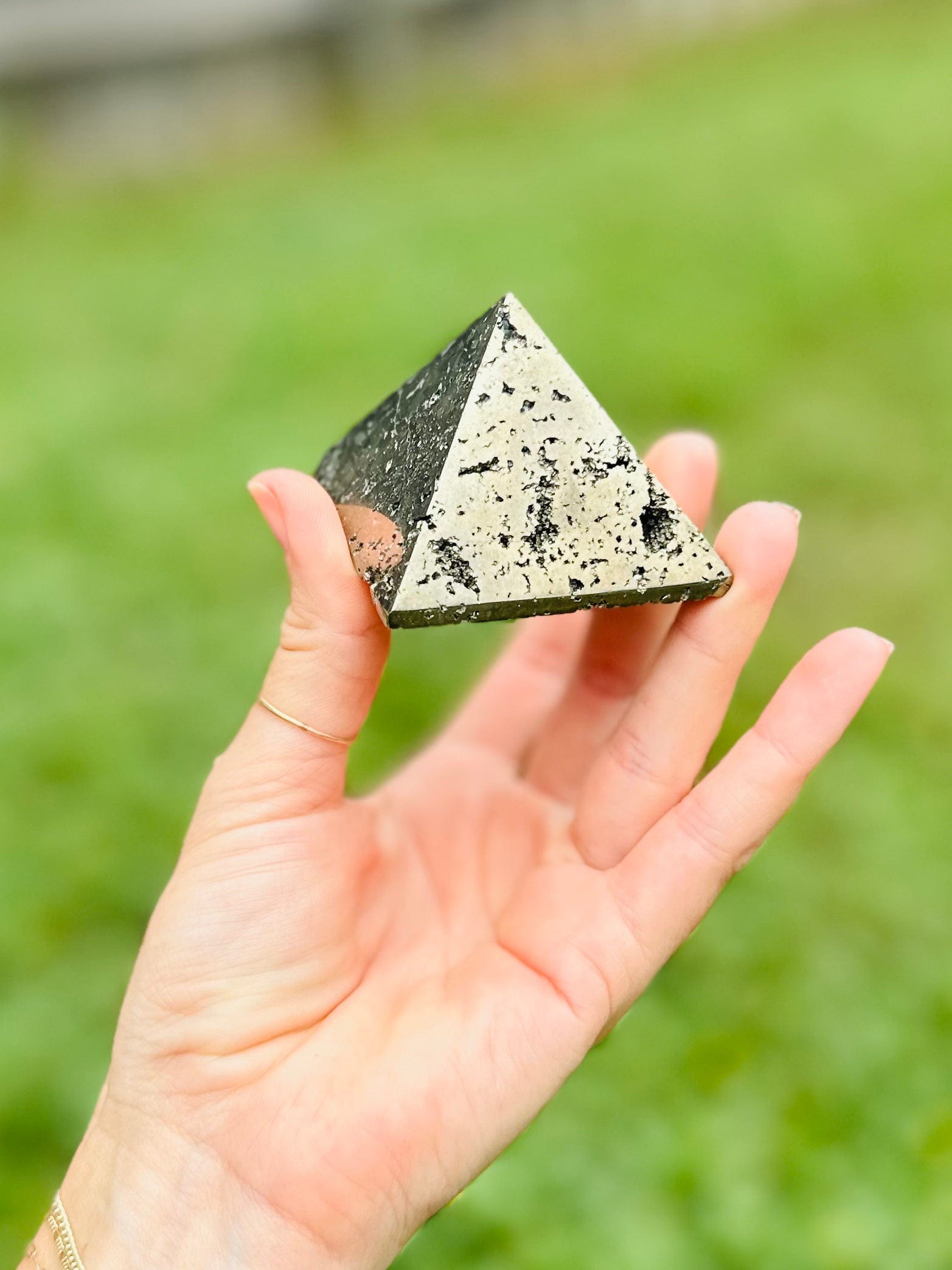Pyrite Pyramid with golden hues attracts wealth, shields from negativity, and promotes focus and success in any space