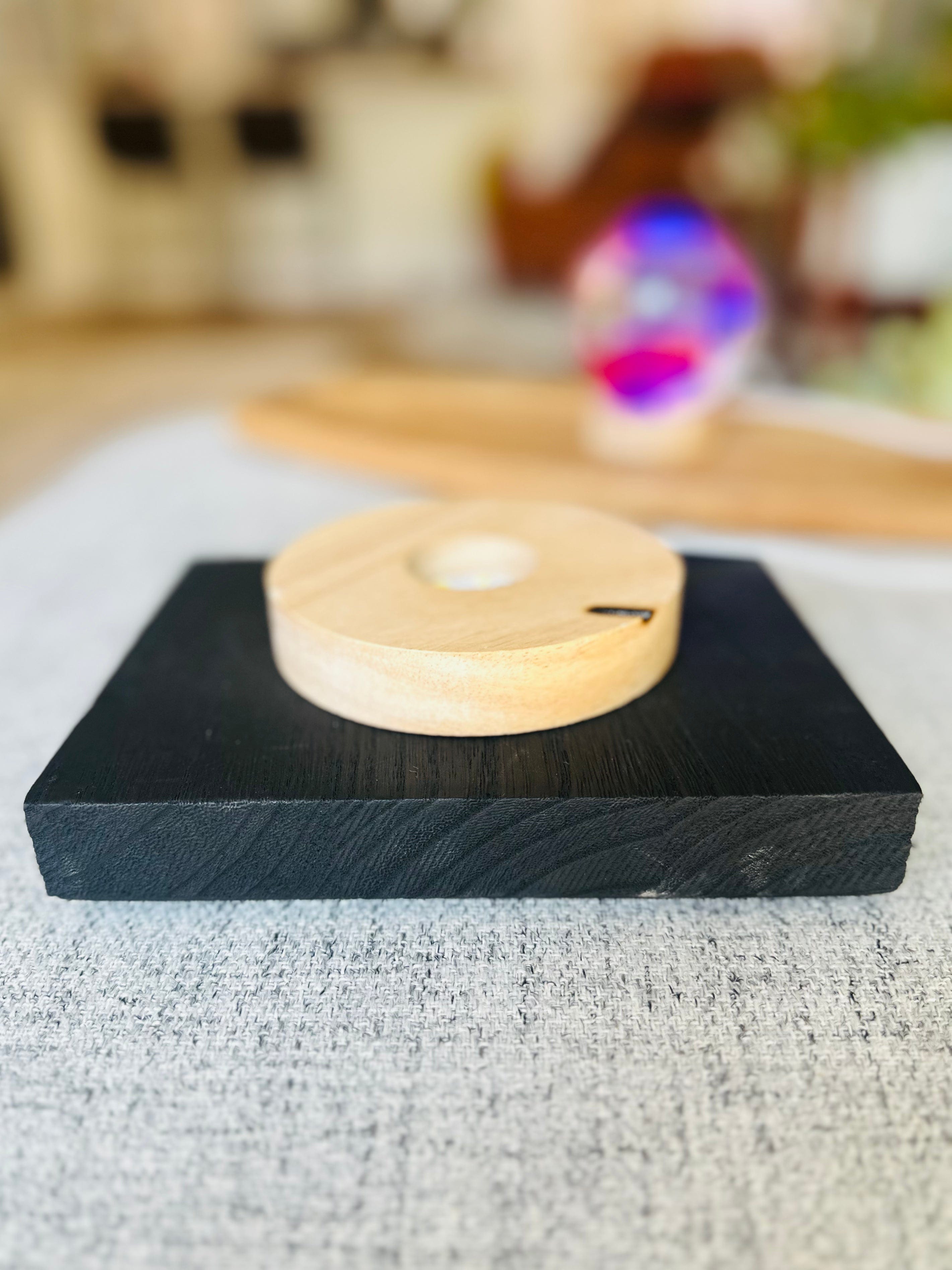 Handcrafted Wooden Crystal Sphere Holders – large holder emits serene white light, small holder transitions through vibrant colors