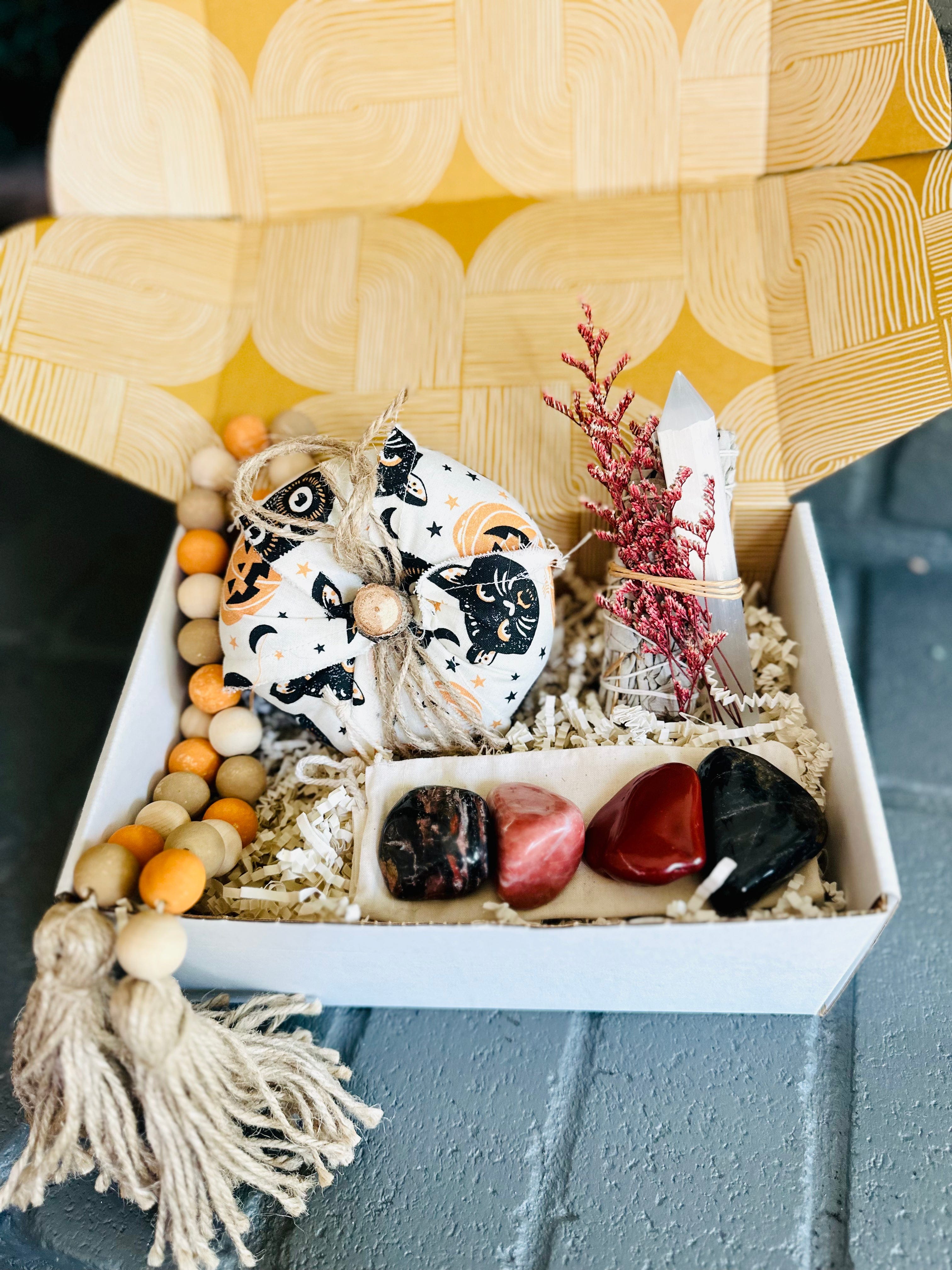 Spooky Vibes Gift Box with a cozy cotton pumpkin, White Sage bundle, Selenite wand, wooden bead decor, and grounding tumbled stones