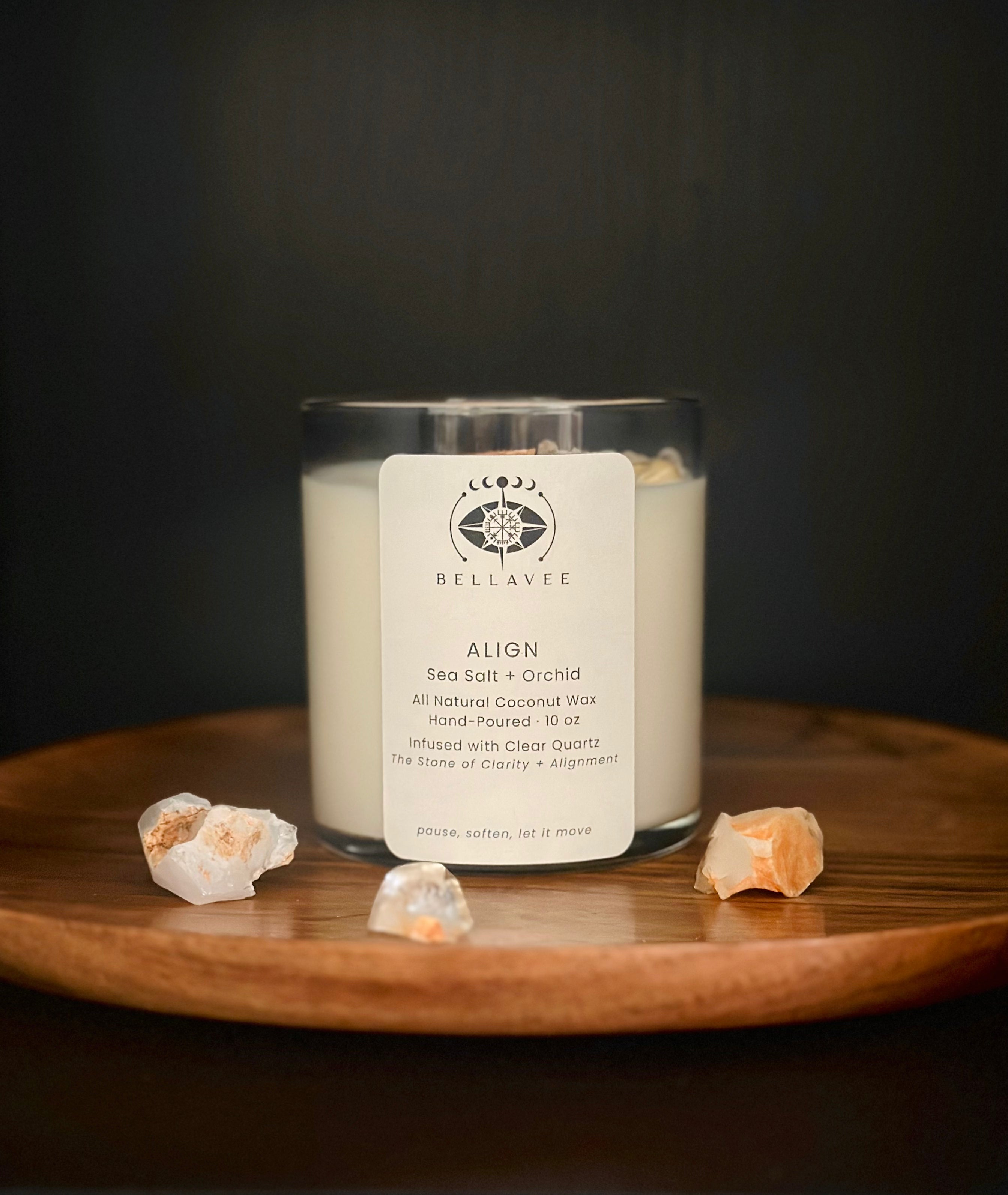Align Clear Quartz crystal ritual candle in a glass vessel on a wooden surface.