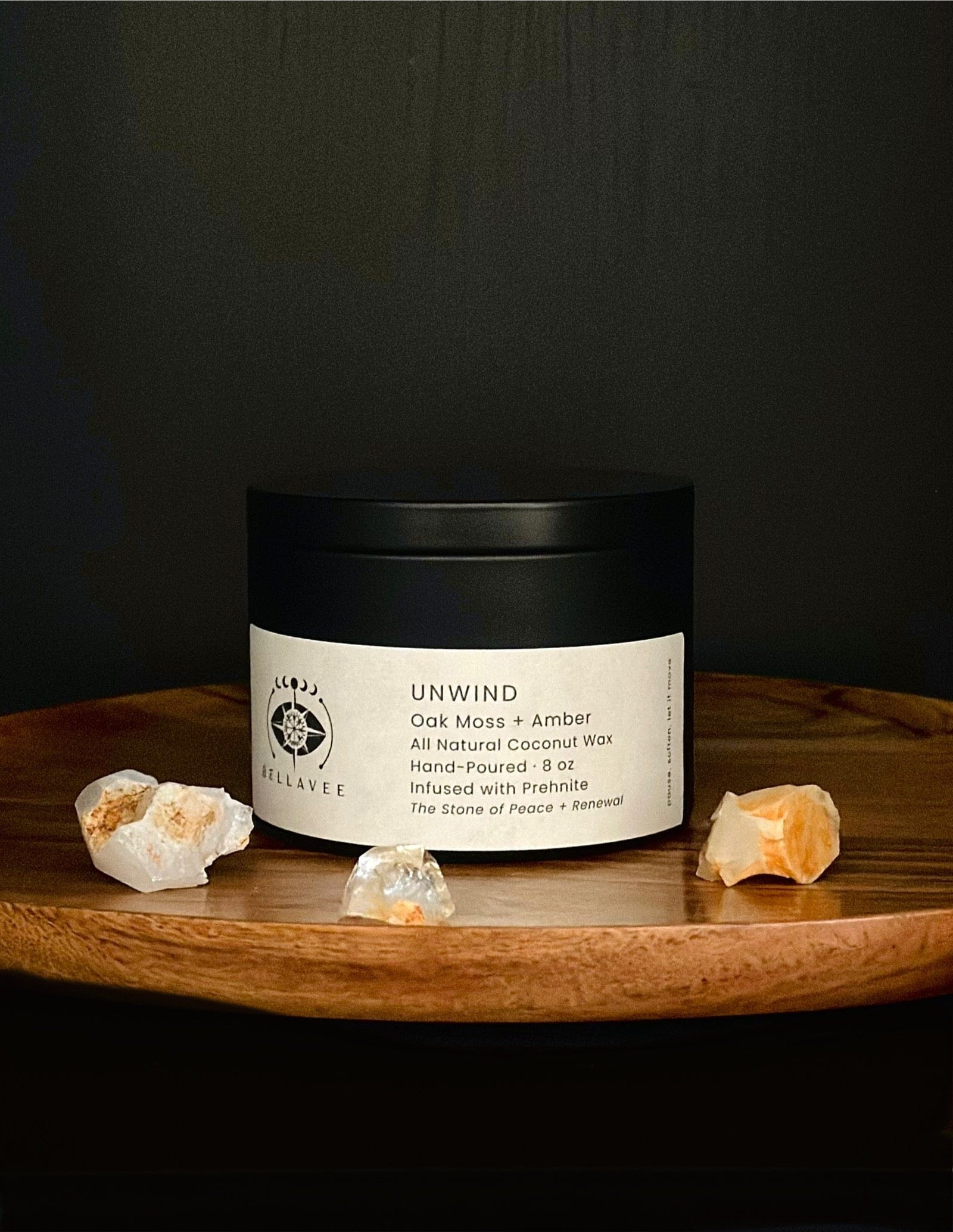 Unwind Prehnite crystal ritual candle tin styled on a wooden surface.