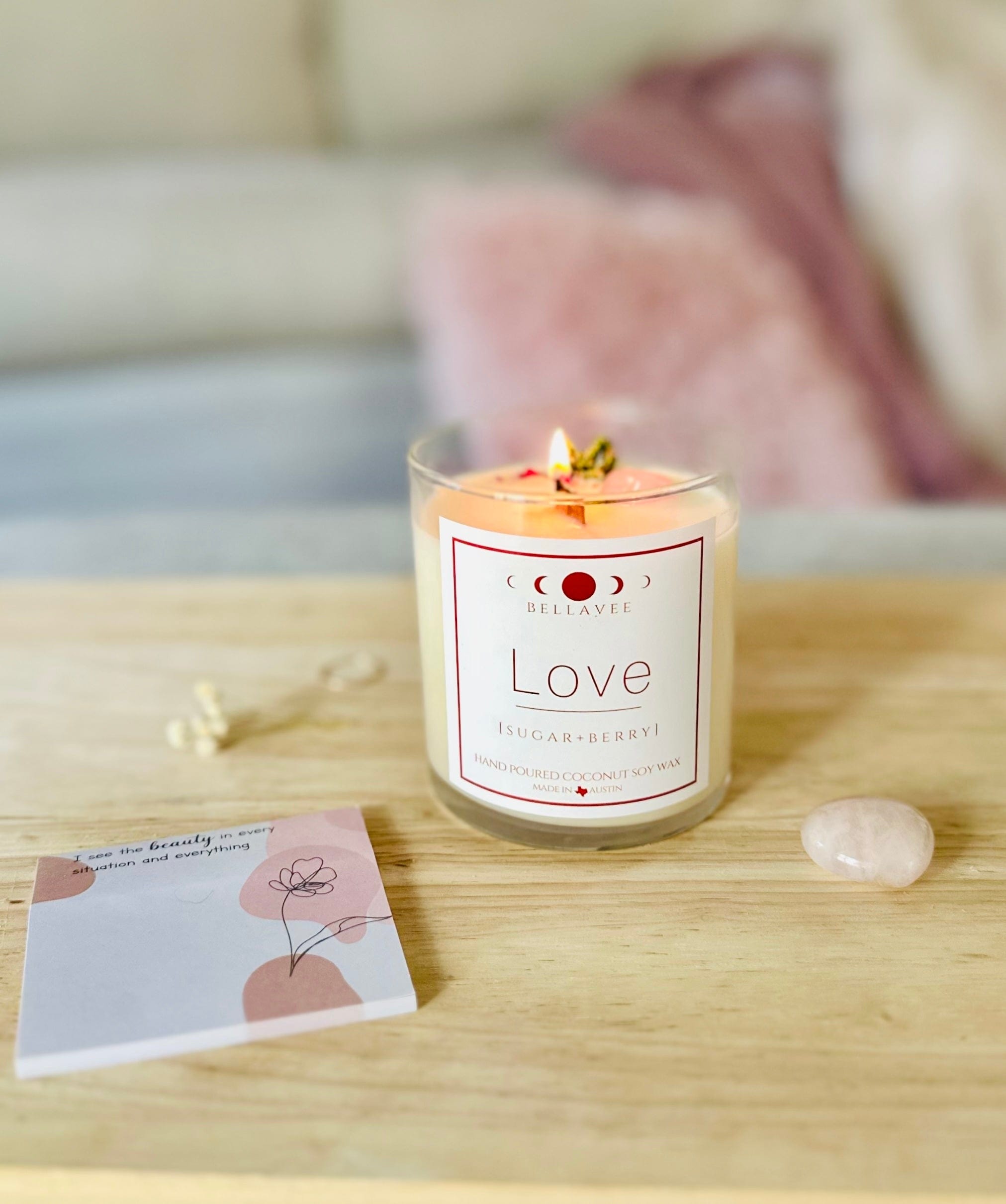Lit Love Rose Quartz Crystal Candle with affirmation card and rose quartz number next to it