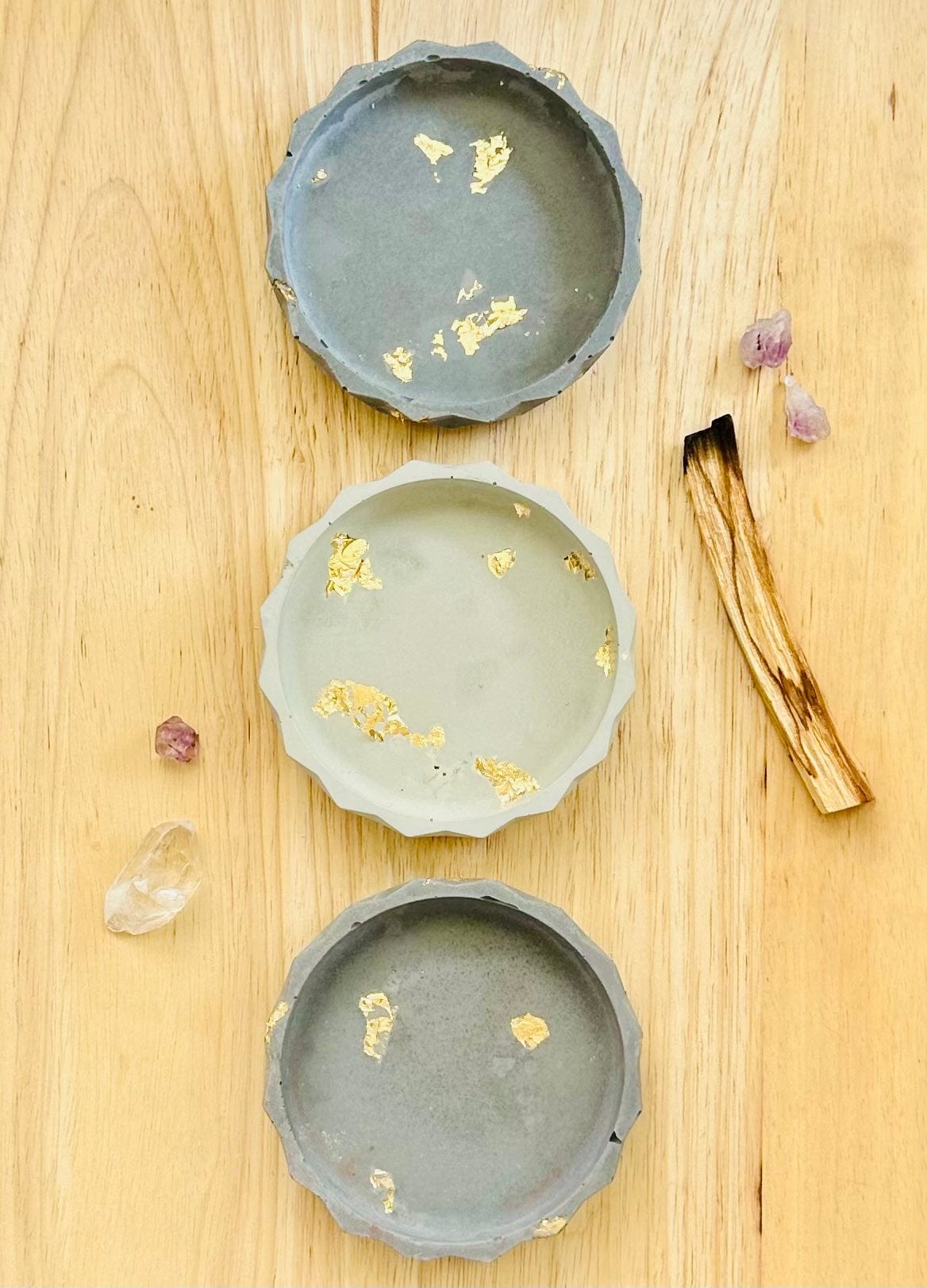 Cement altar dish with palo Santo and crystal point