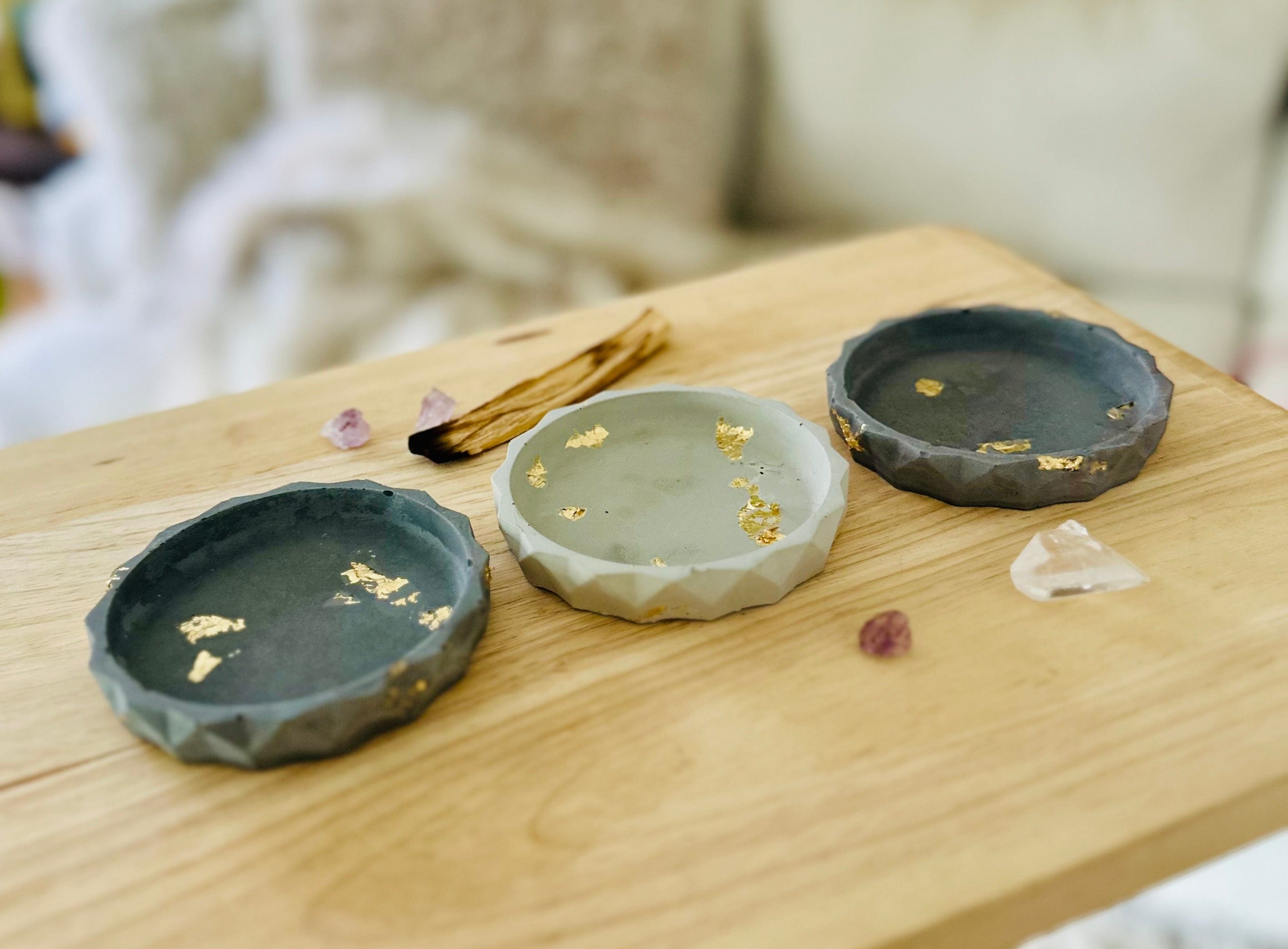 Flat lay of multiple cement dishes showing color variations