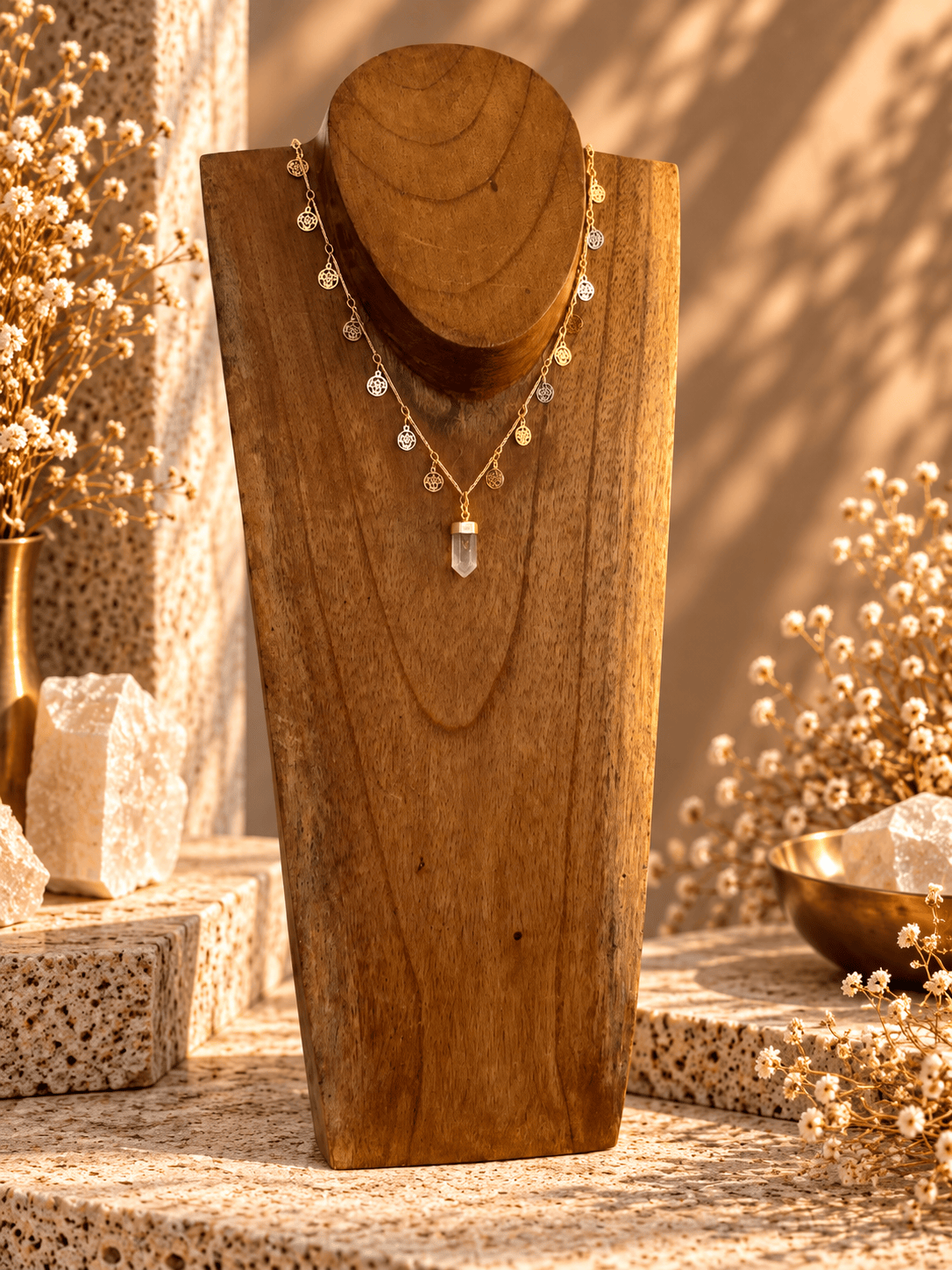 Rutilated Quartz point necklace with delicate openwork medallion details on gold chain