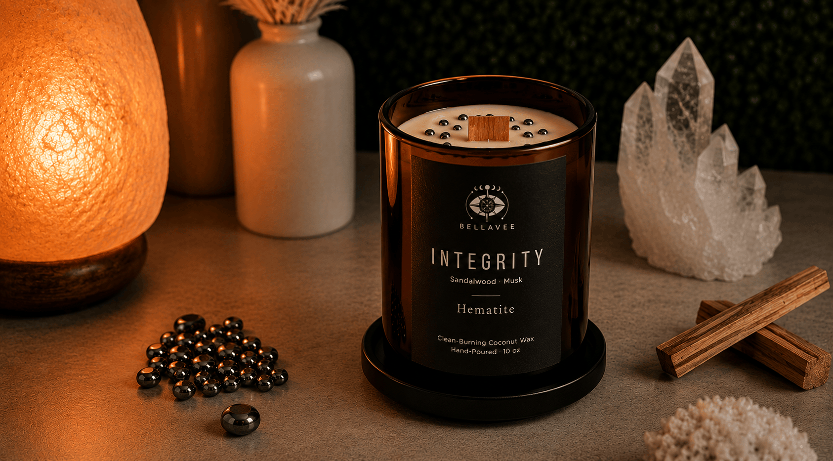 Candle labeled 'Integrity' on a table with decorative items