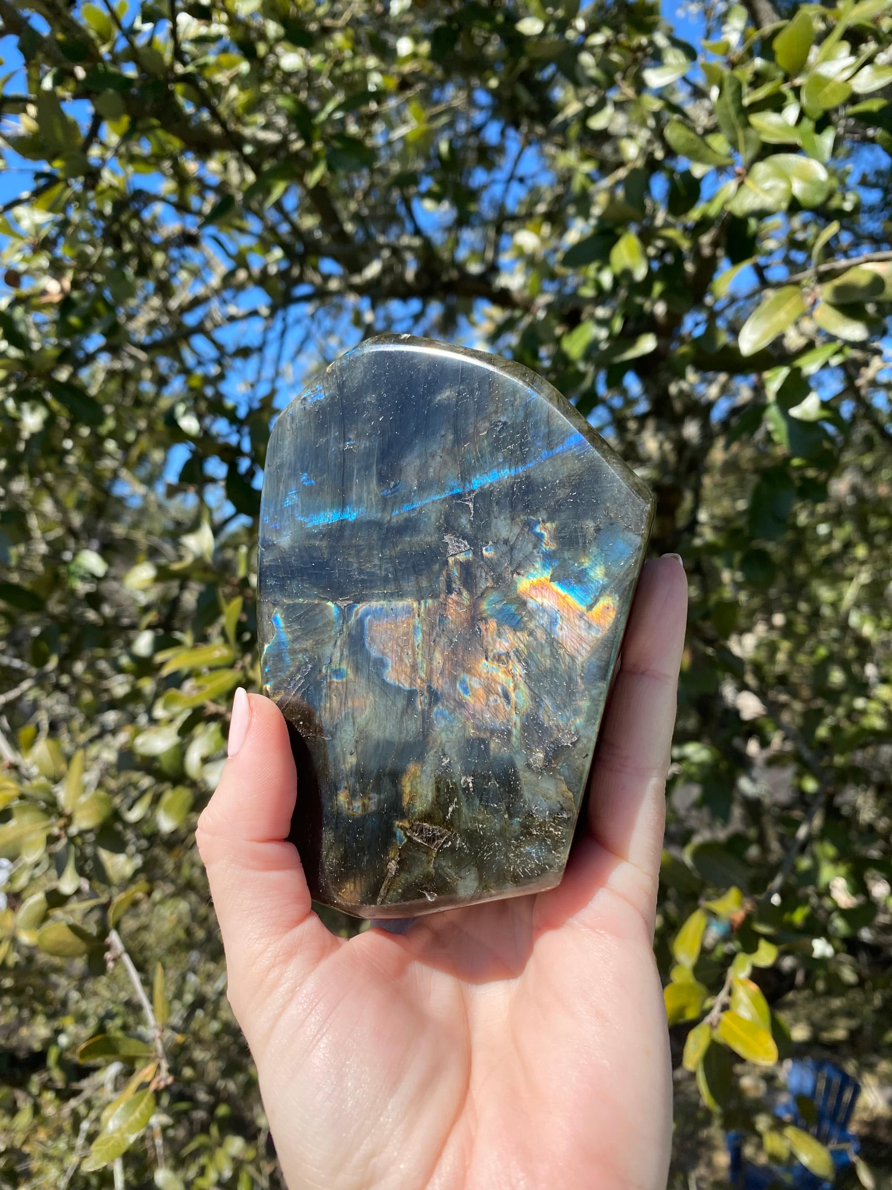 Rainbow Labradorite Freeform shines with blues, yellows, and reds when held up under the sun, revealing stunning labradorescence