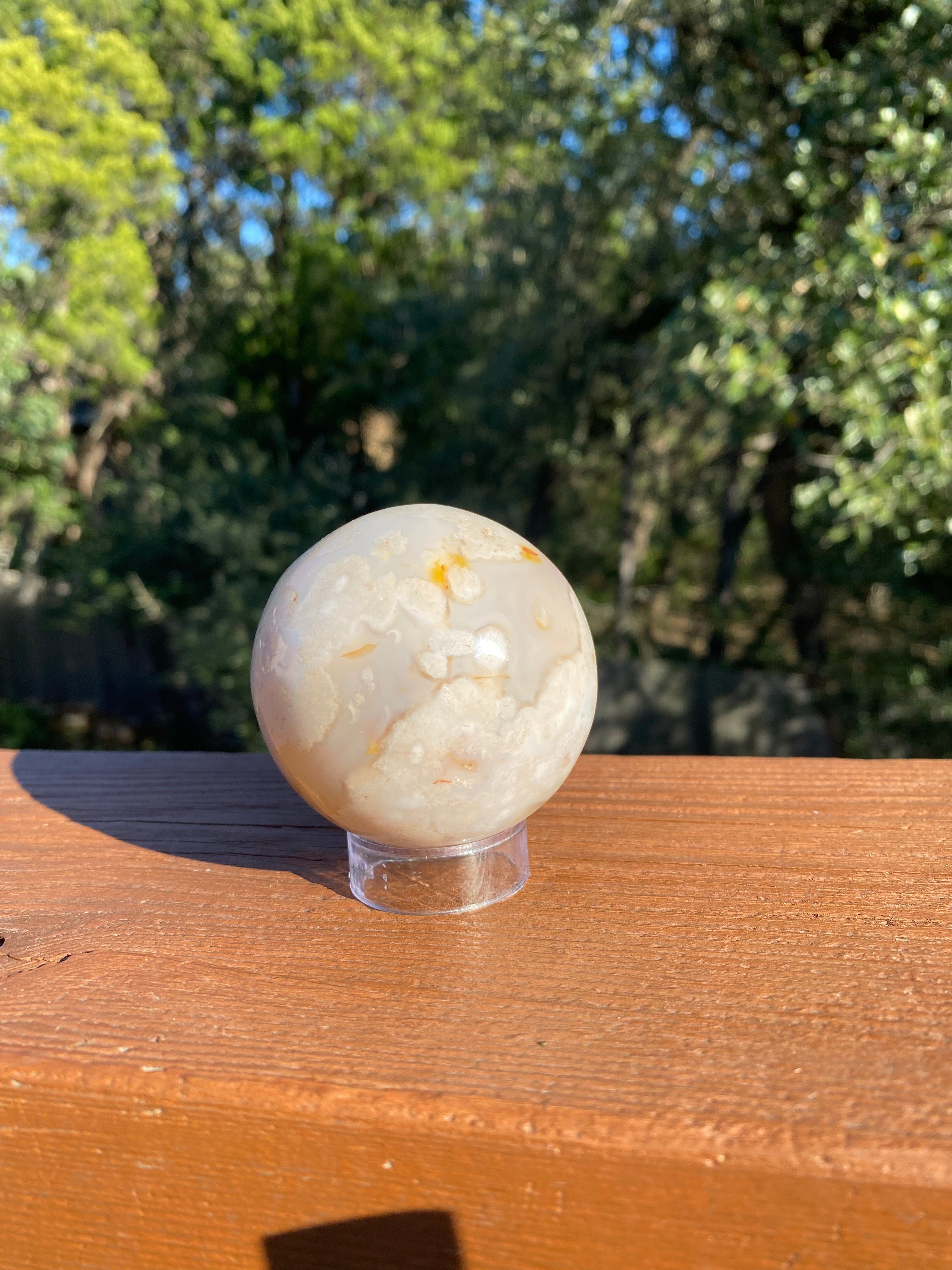 Flower Agate Sphere, with soft floral hues, promotes emotional healing, inner peace, and growth, perfect for meditation or décor