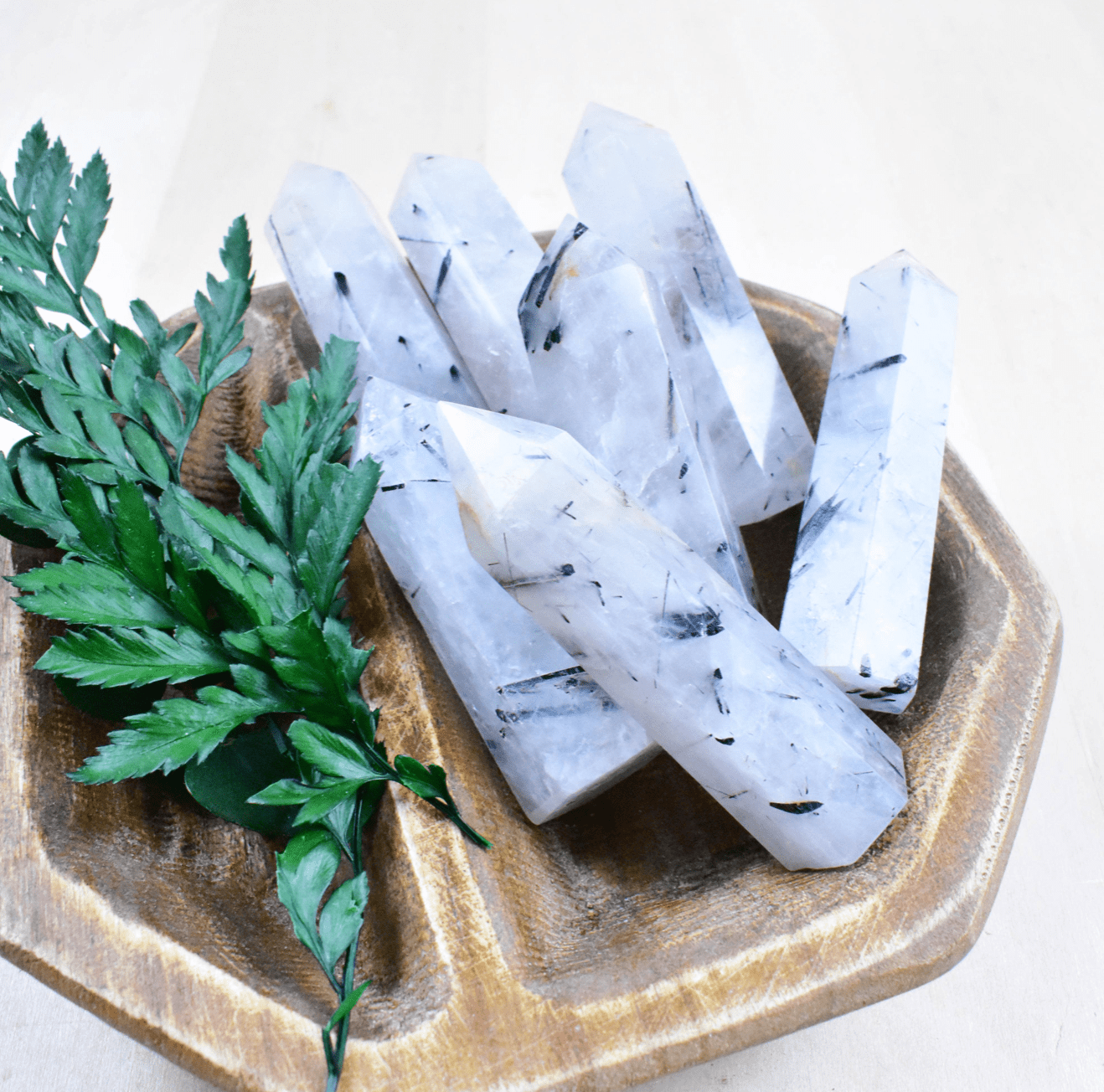 A group of Tourmaline in Quartz Points shields against negative energy and amplifies positive vibrations, perfect for any space
