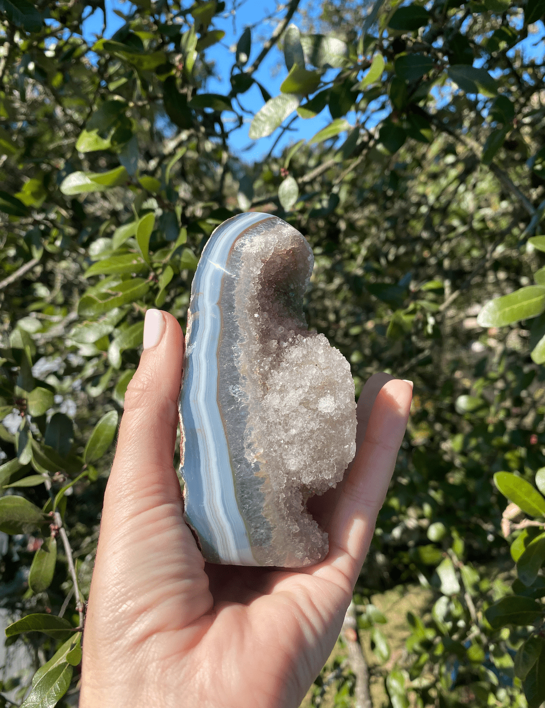 brazilian blue agate with quartz crystals, delicate yet strong, balancing positive and negative energies with natural beauty