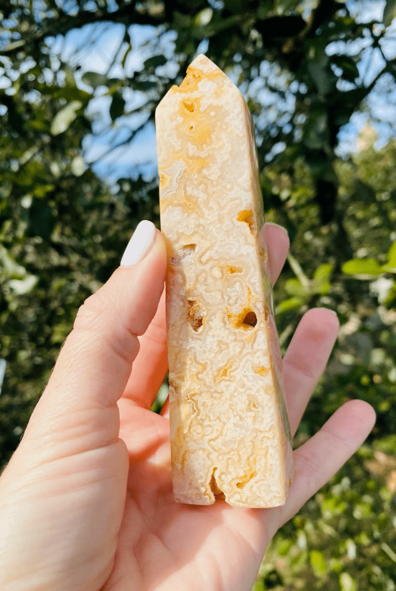 Hold the radiant Yellow Agate Tower to feel its uplifting energy, with bright, sunny hues that enhance self-assurance and emotional balance