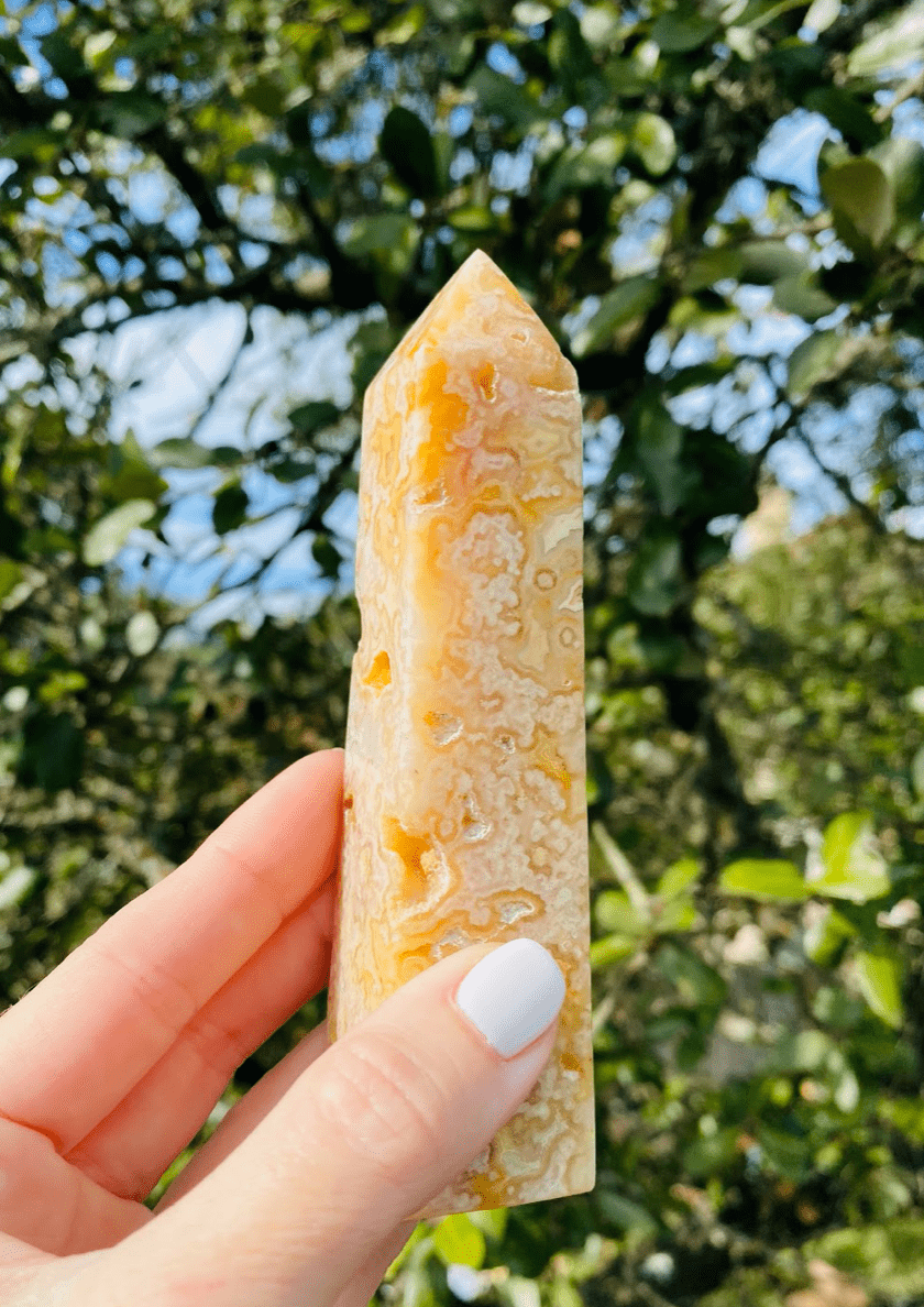 stunning Yellow Agate Tower, with its vibrant yellow tones, radiates positivity and grounding energy, ideal for meditation and decor
