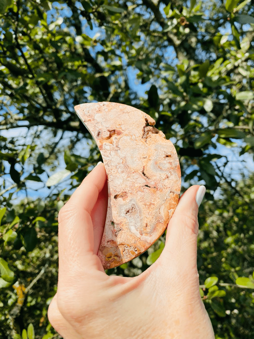 When held up to the sky, the Sliced Agate Crescent Moon reveals its stunning colors, promoting grounding energy and positivity