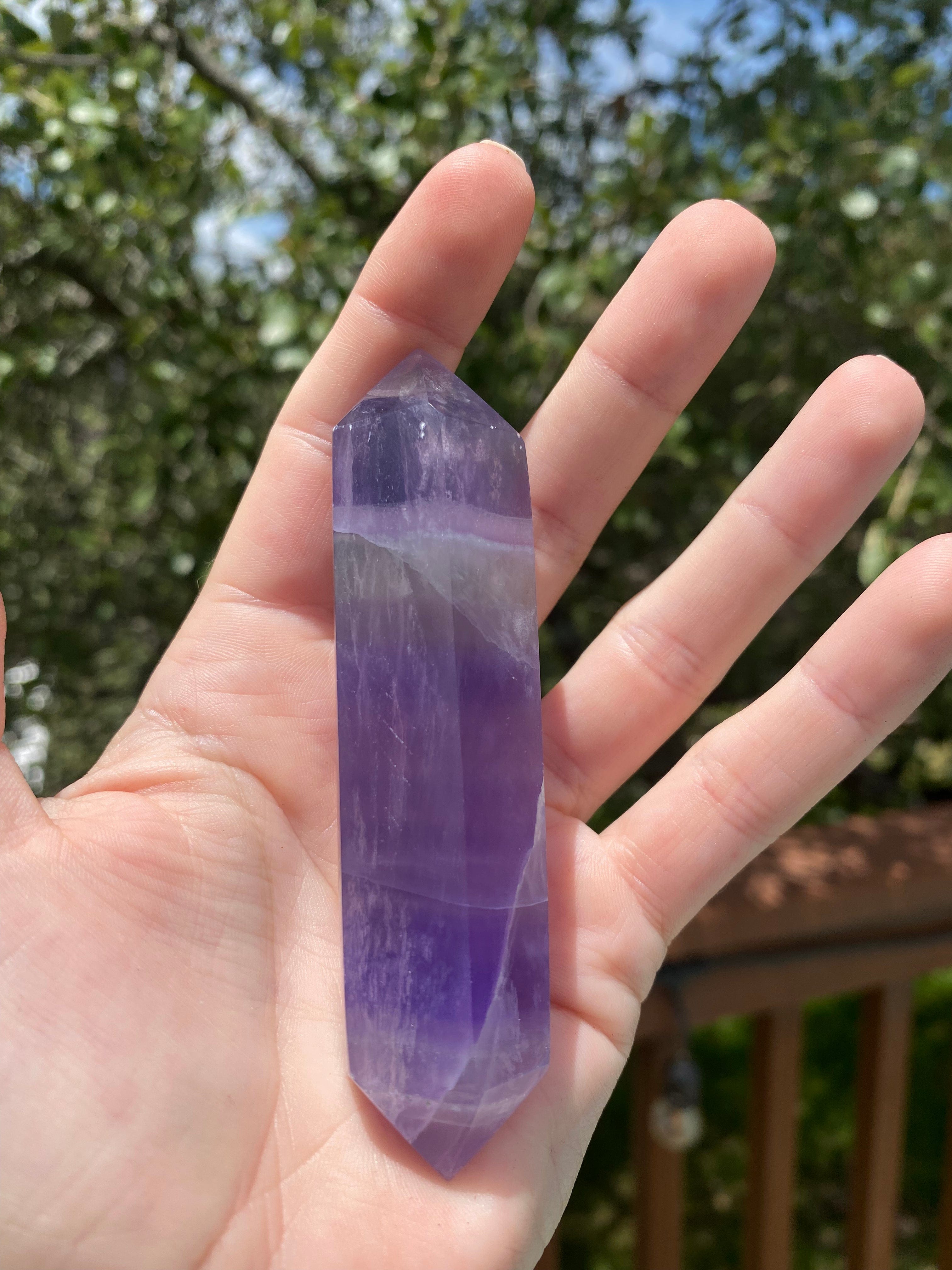 double-terminated purple fluorite crystal, detoxifies energy, enhances clarity, connects with the crown chakra for peace and protection