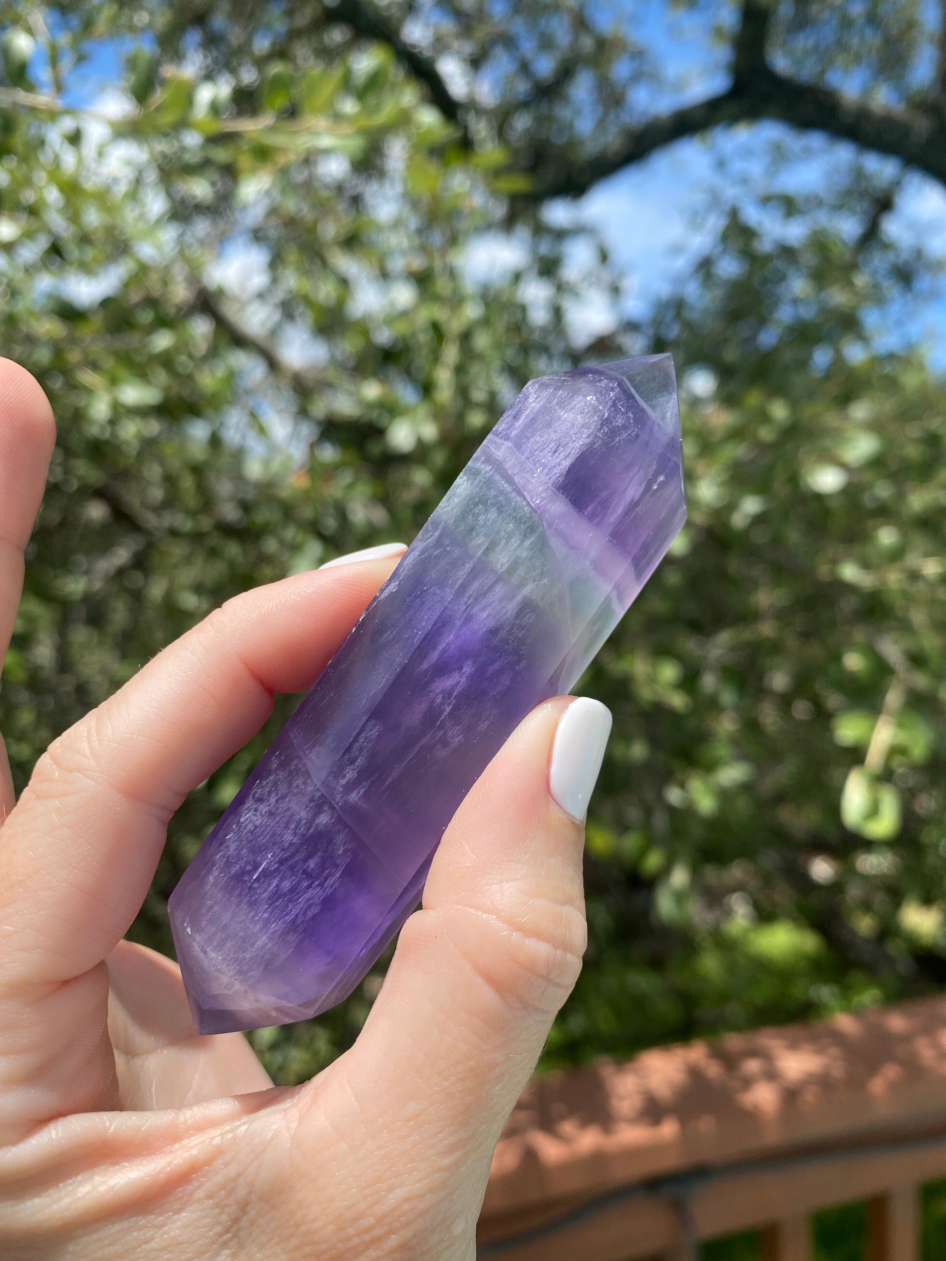 purple fluorite double-terminated crystal, connects to the crown chakra, promoting spiritual awakening, protection, and peace