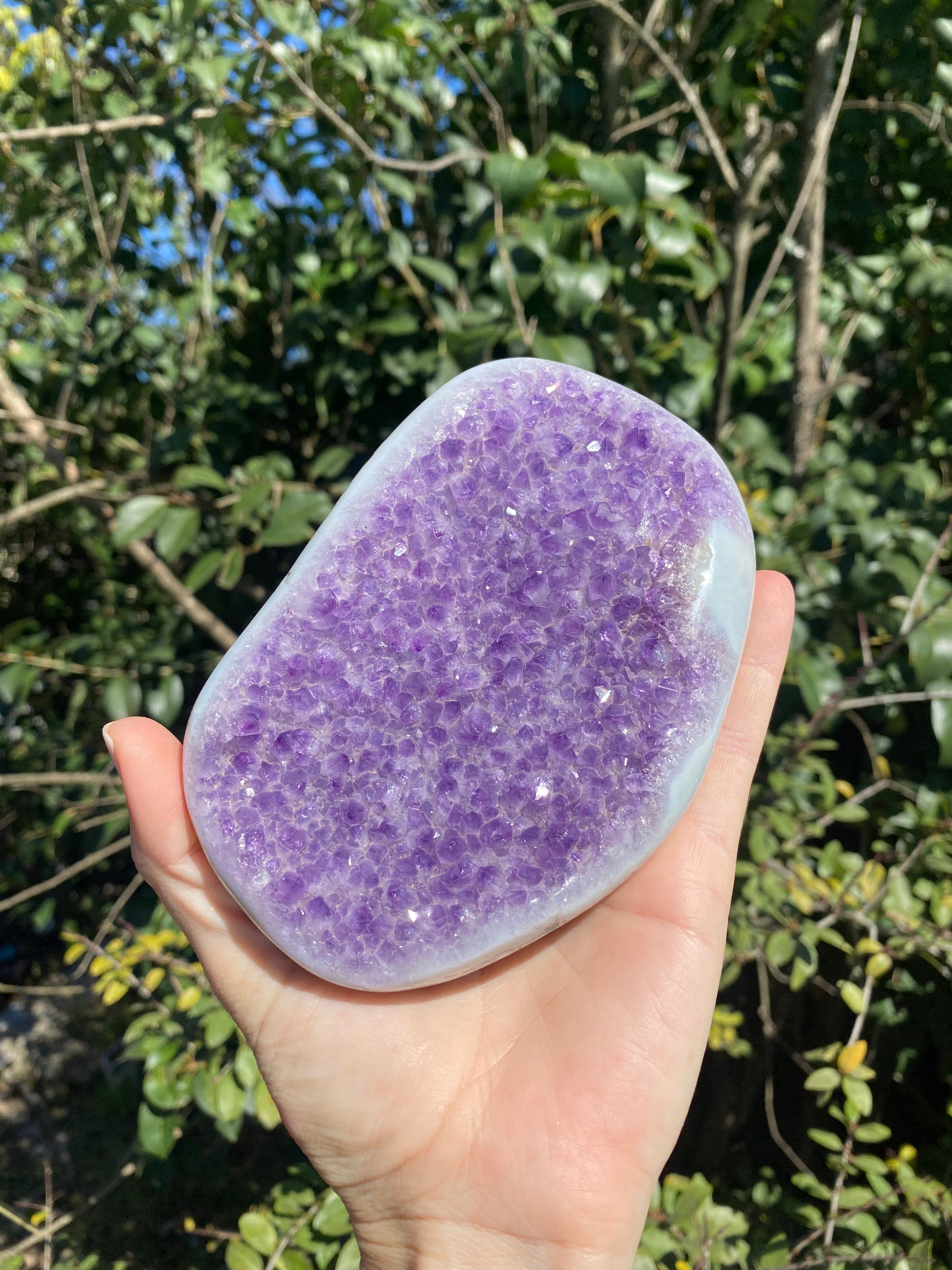 Amethyst crystal with baby blue and white Agate banding, shimmering in the sunlight, radiating calming energy.
