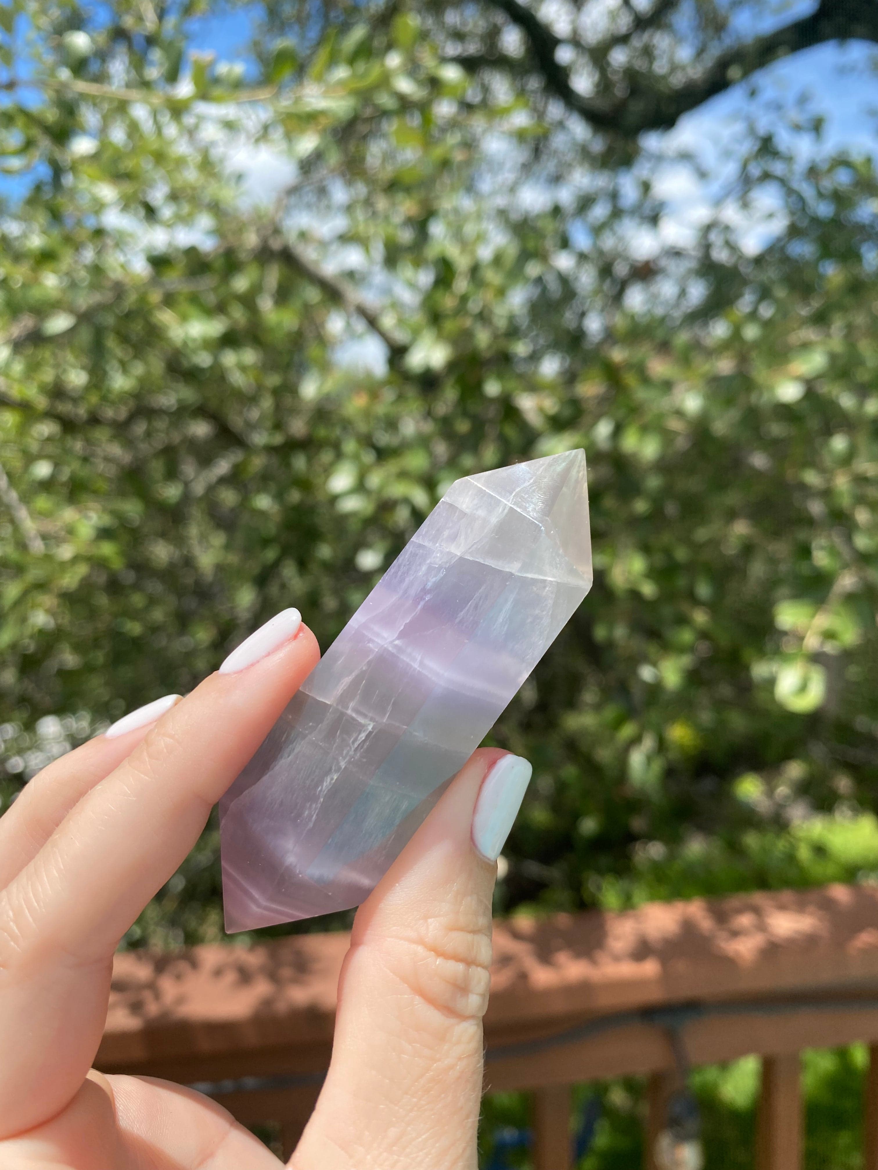 purple fluorite crystal, double-terminated design for energy cleansing, linked to the crown chakra for spiritual protection and peace
