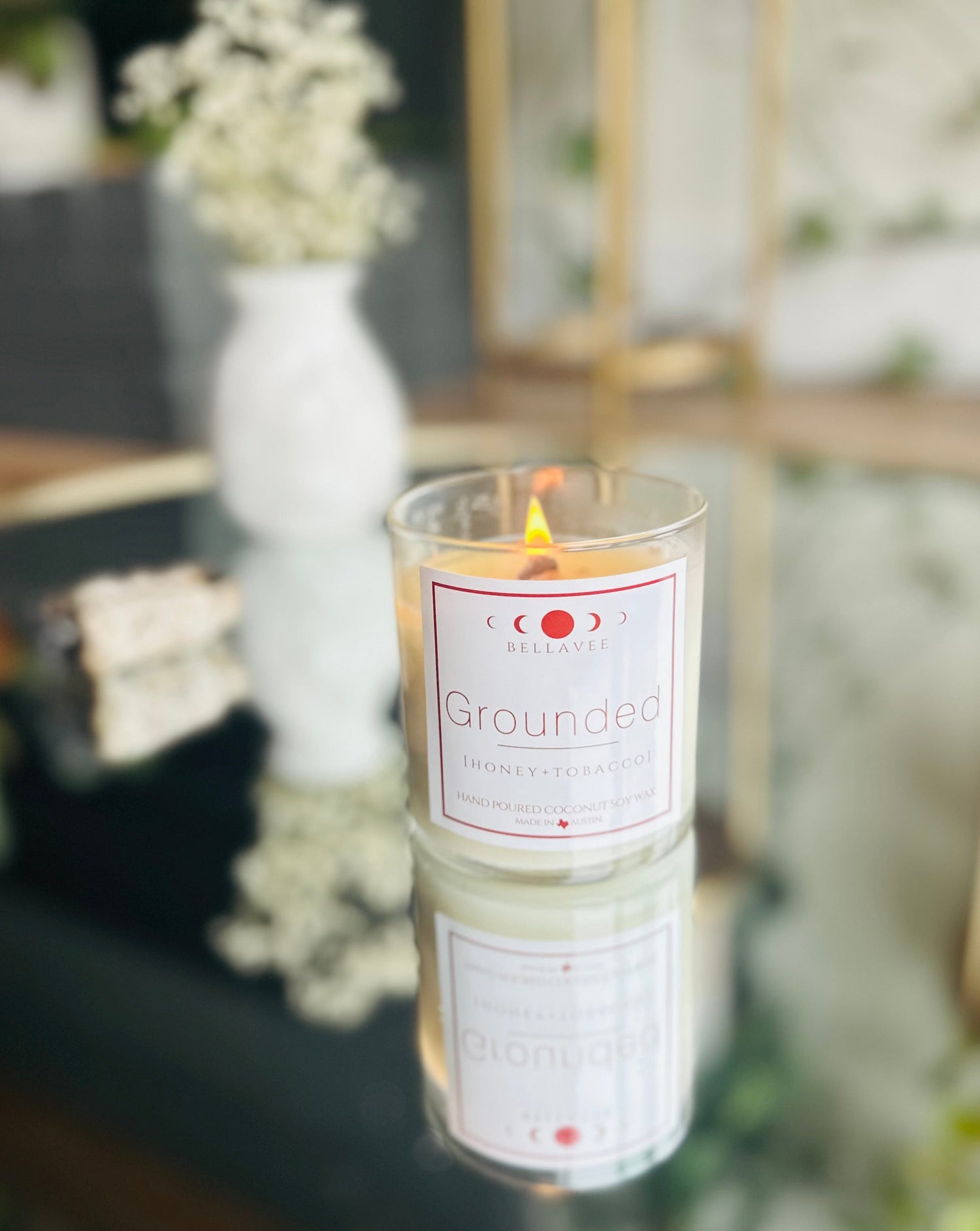 Grounded Crystal Candle infused with Tigers Eye, wooden wick, and dried flowers, evoking warmth and tranquility with its calming aroma