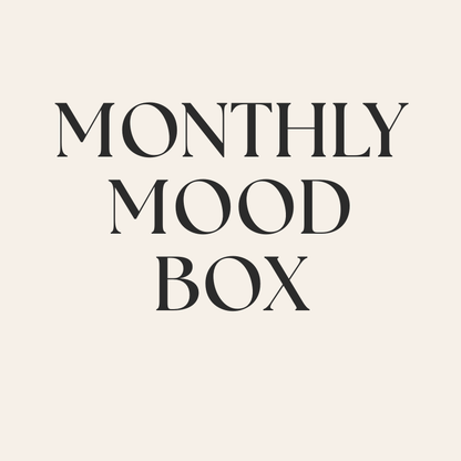 monthly mood box subscription with bold lettering on cream background