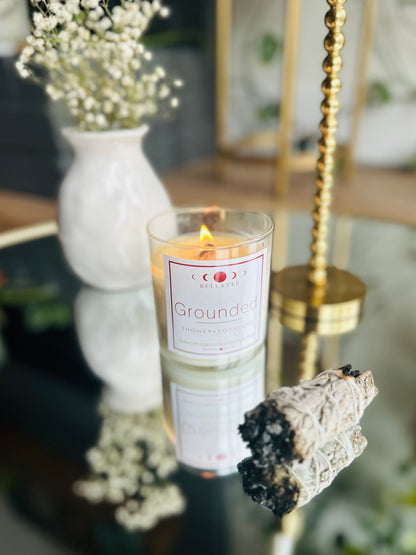 Grounded Crystal Candle with Tigers Eye and wooden wick, offering a captivating aroma of honey, tobacco, and tonka for balance and peace