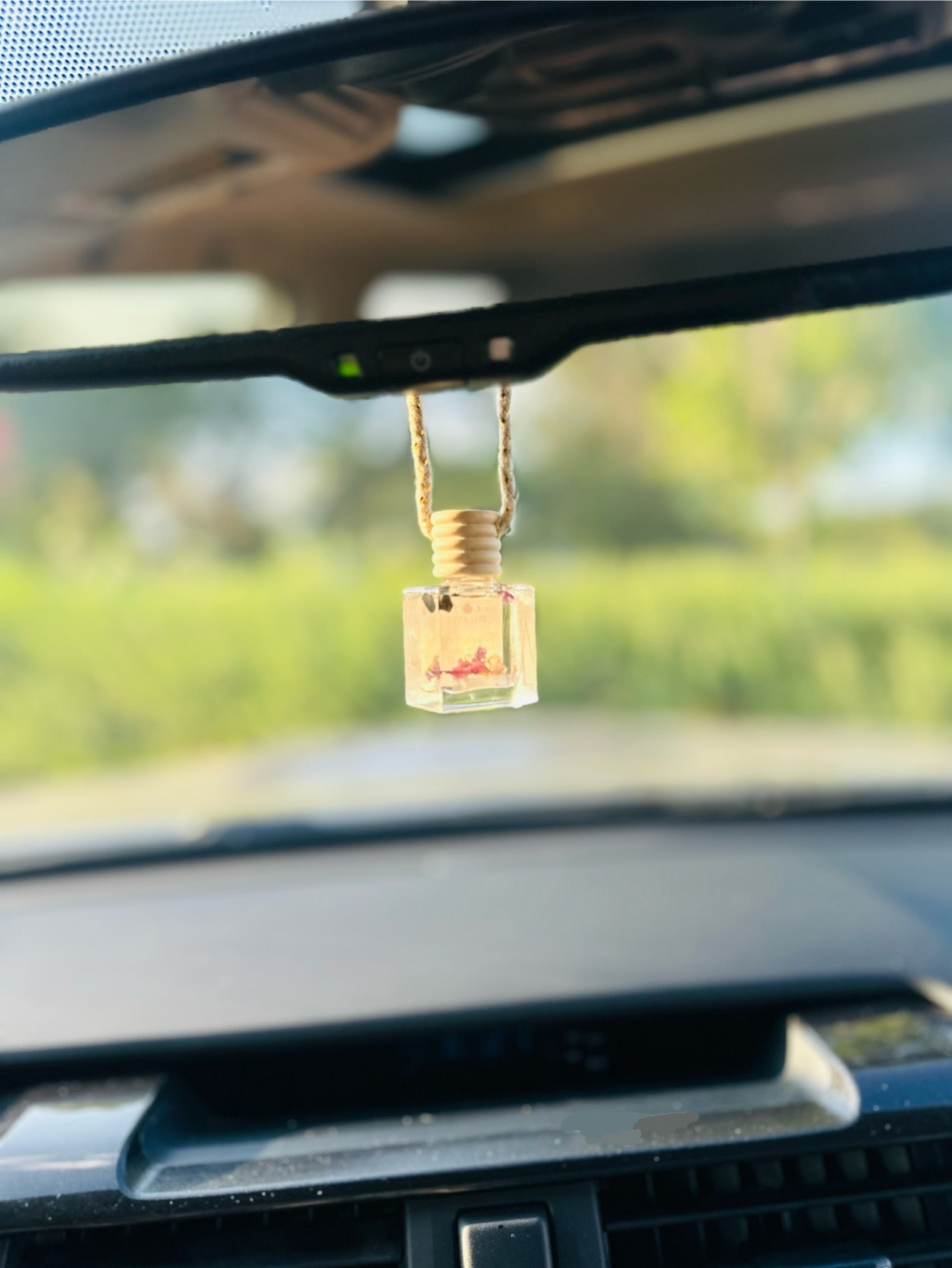 Reusable car diffuser made from organic materials, providing a refreshing citrus scent.