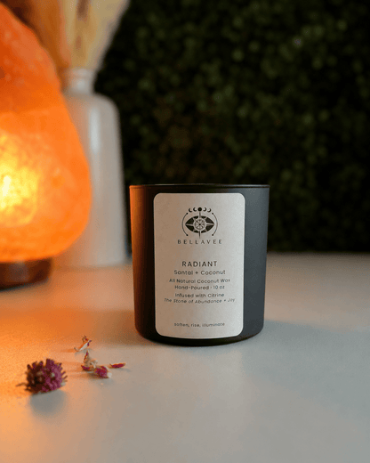BellaVee Radiant non-toxic crystal candle in matte black vessel with warm ambient lighting