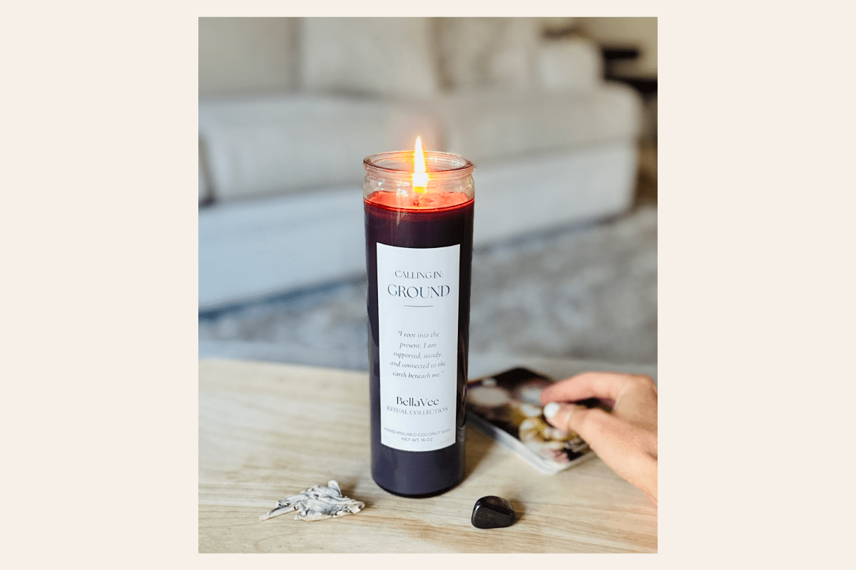 Tall Calling in Ground Candle with a label on a table in a living room setting