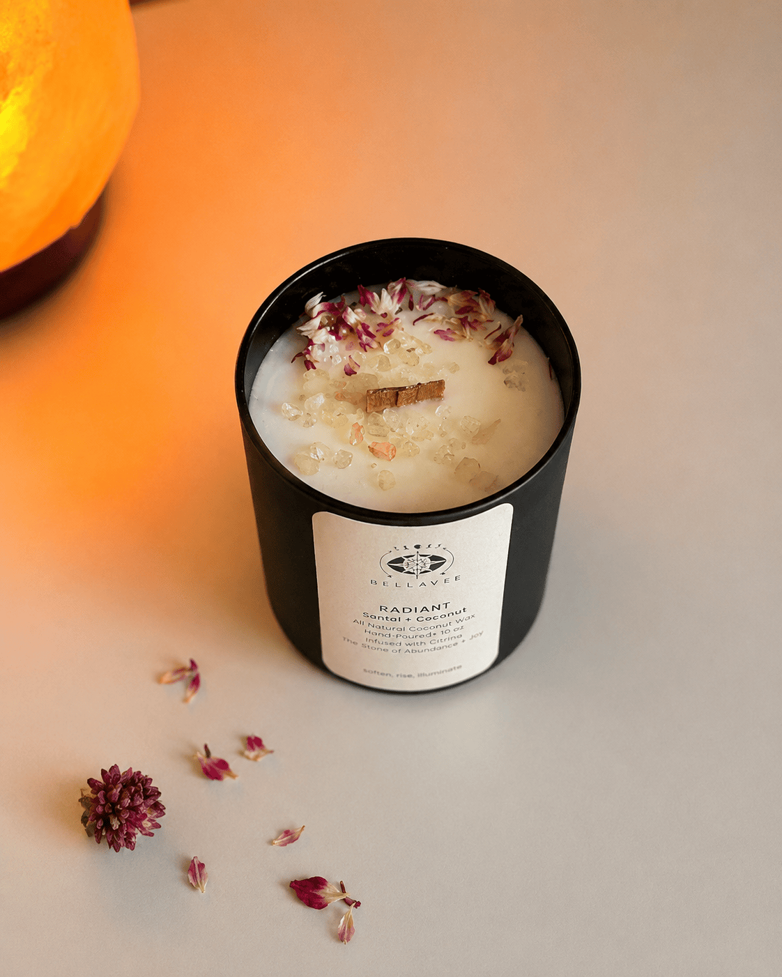Top view of BellaVee Radiant candle featuring citrine crystals, wooden wick, and dried florals