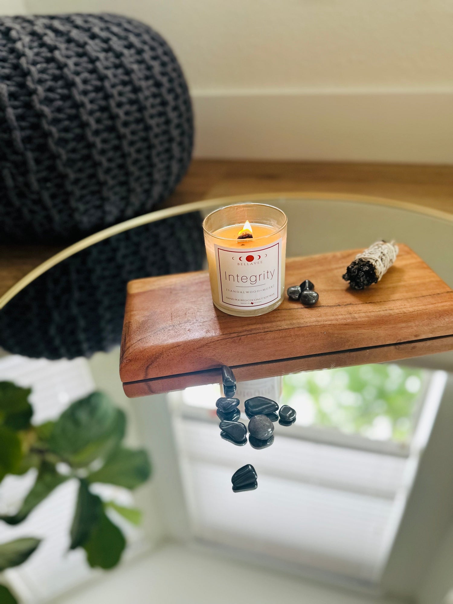Lit Integrity Crystal Candle with Hematite, coconut soy wax, and wooden wick, offering a calming and grounding ambiance with soothing scents