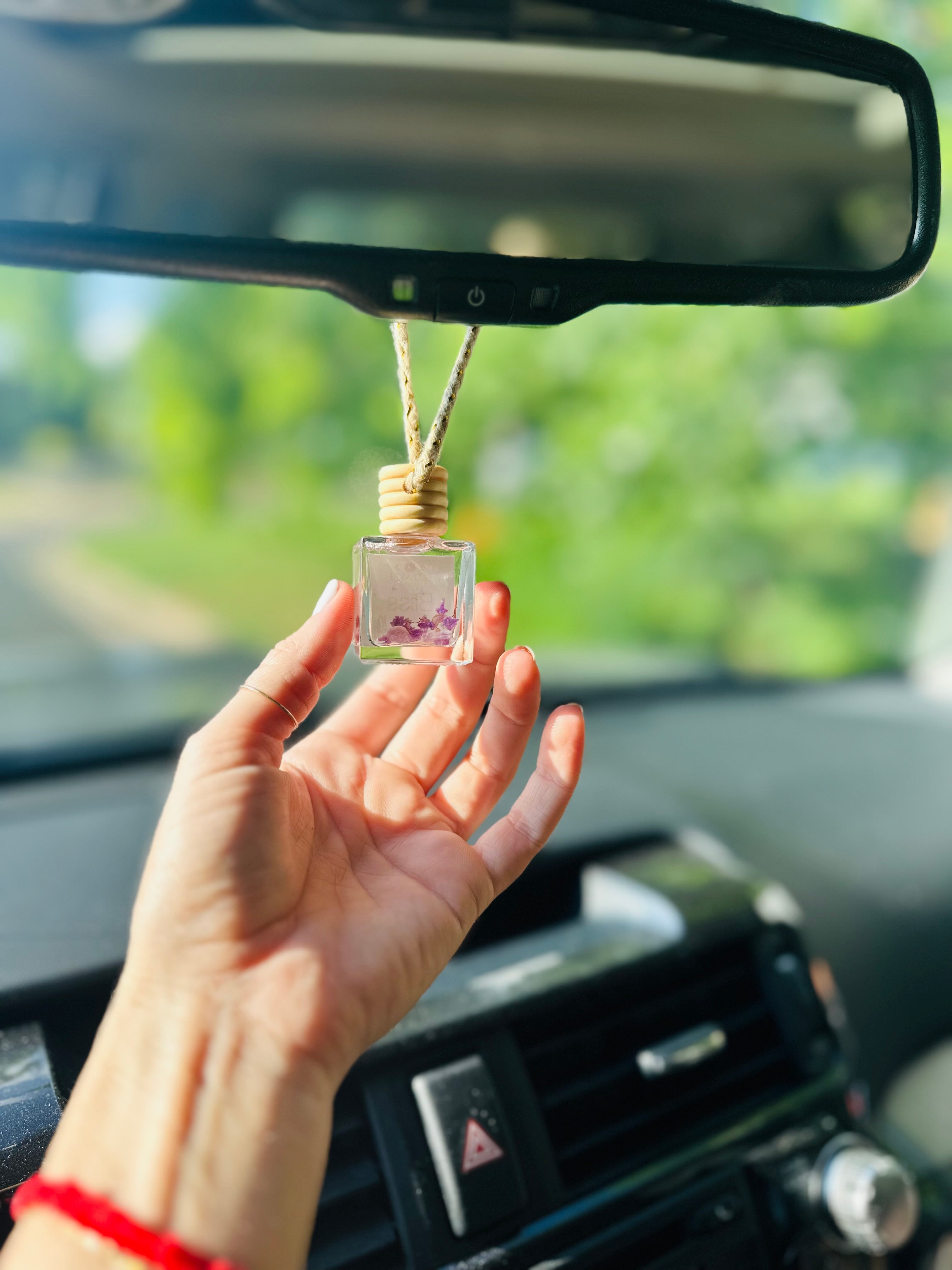 All-natural car diffuser with sandalwood and amber essential oils for a calming travel experience.