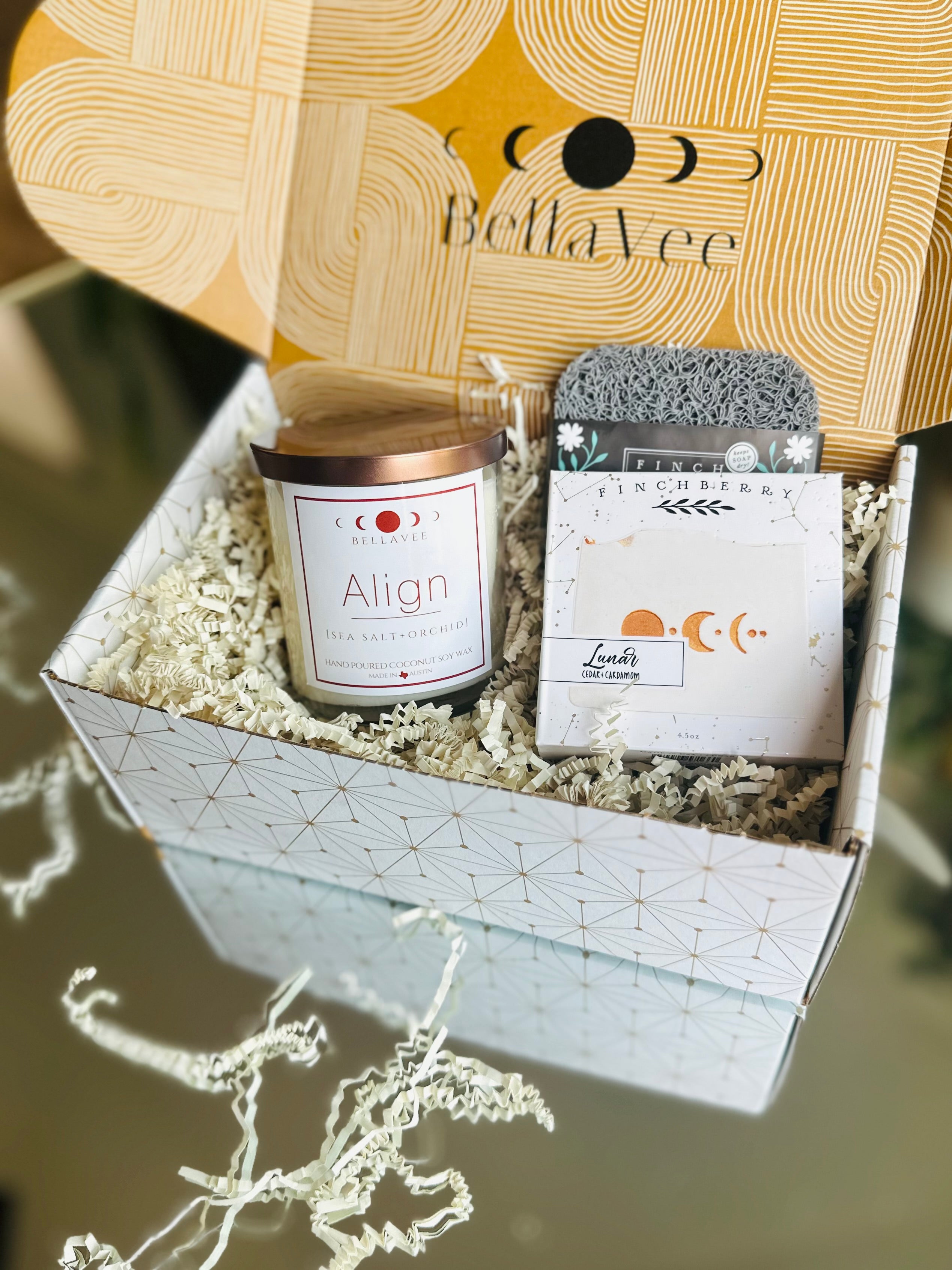 Inside the Welcome Home set, discover a soothing crystal candle, luxurious lunar soap, and palo santo bundle to fill their space with peace