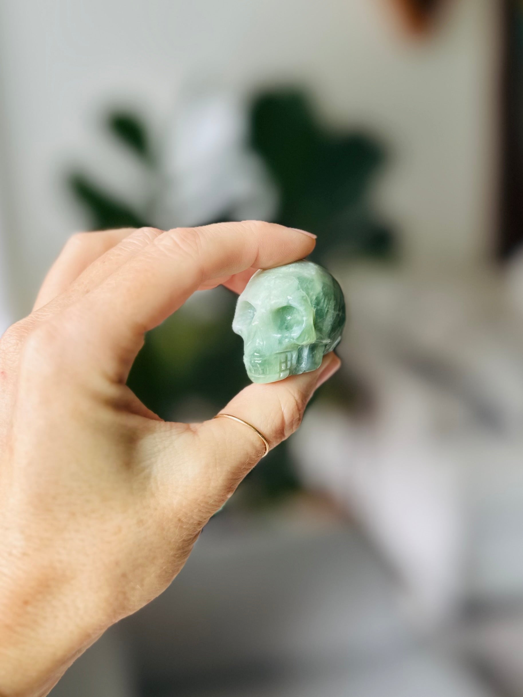 jade crystal skull symbol of purity and serenity, promoting emotional healing and prosperity with connection to the heart chakra