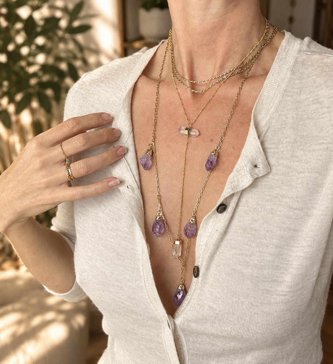 woman wearing Two-stone crystal Y-drop necklace layered with BellaVee crystal jewelry 
