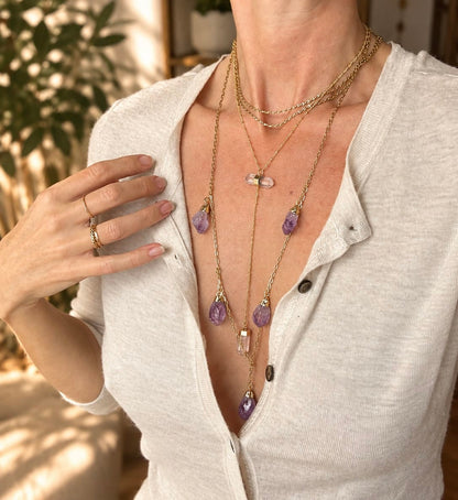woman wearing Two-stone crystal Y-drop necklace layered with BellaVee crystal jewelry 
