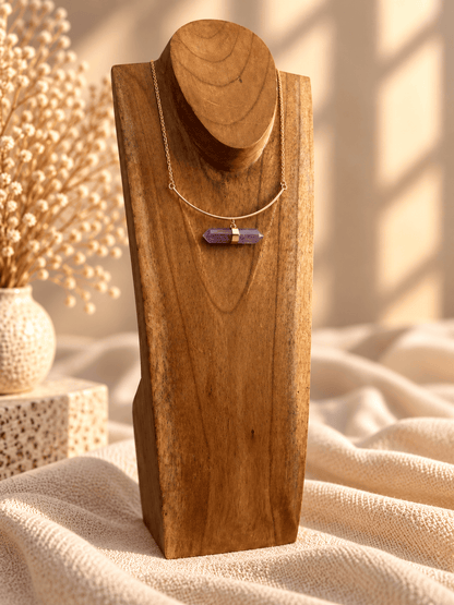 Amethyst double-terminated crystal necklace with curved gold bar