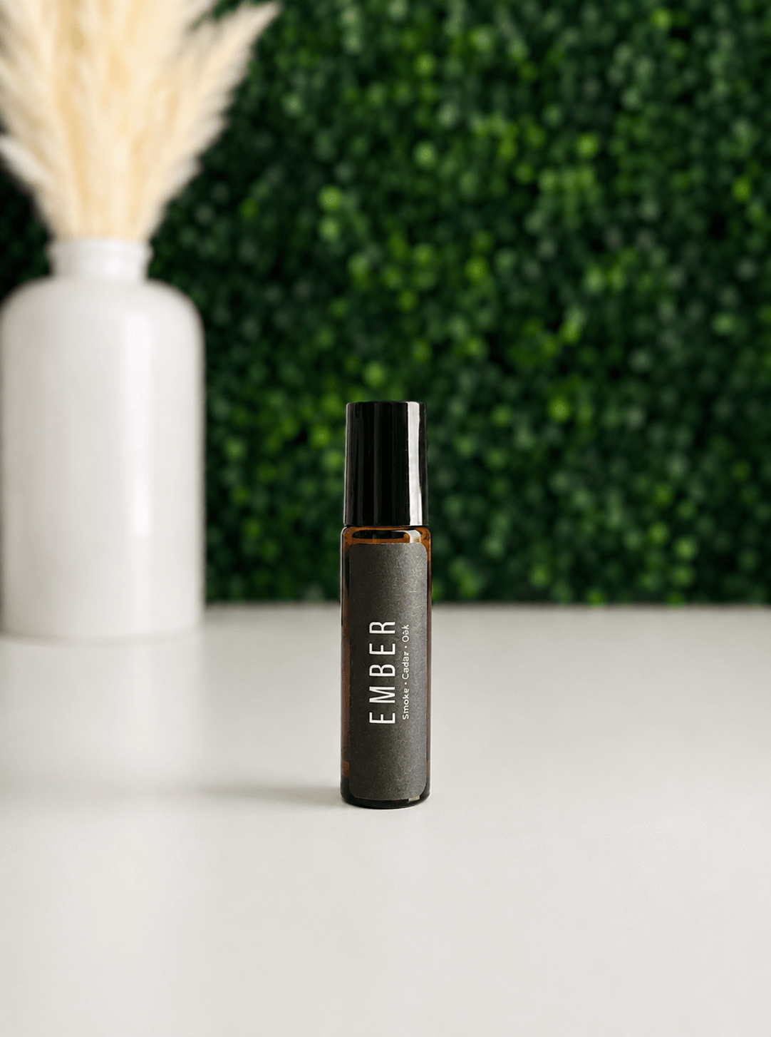 BellaVee Ember roll-on oil featuring smoke cedar and oak fragrance notes
