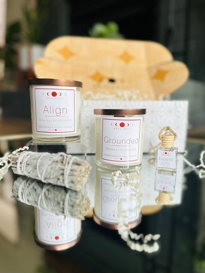 New Beginnings Gift Box: Includes two crystal-infused candles, a handmade crystal car diffuser, and a sage bundle for a serene home atmosphere