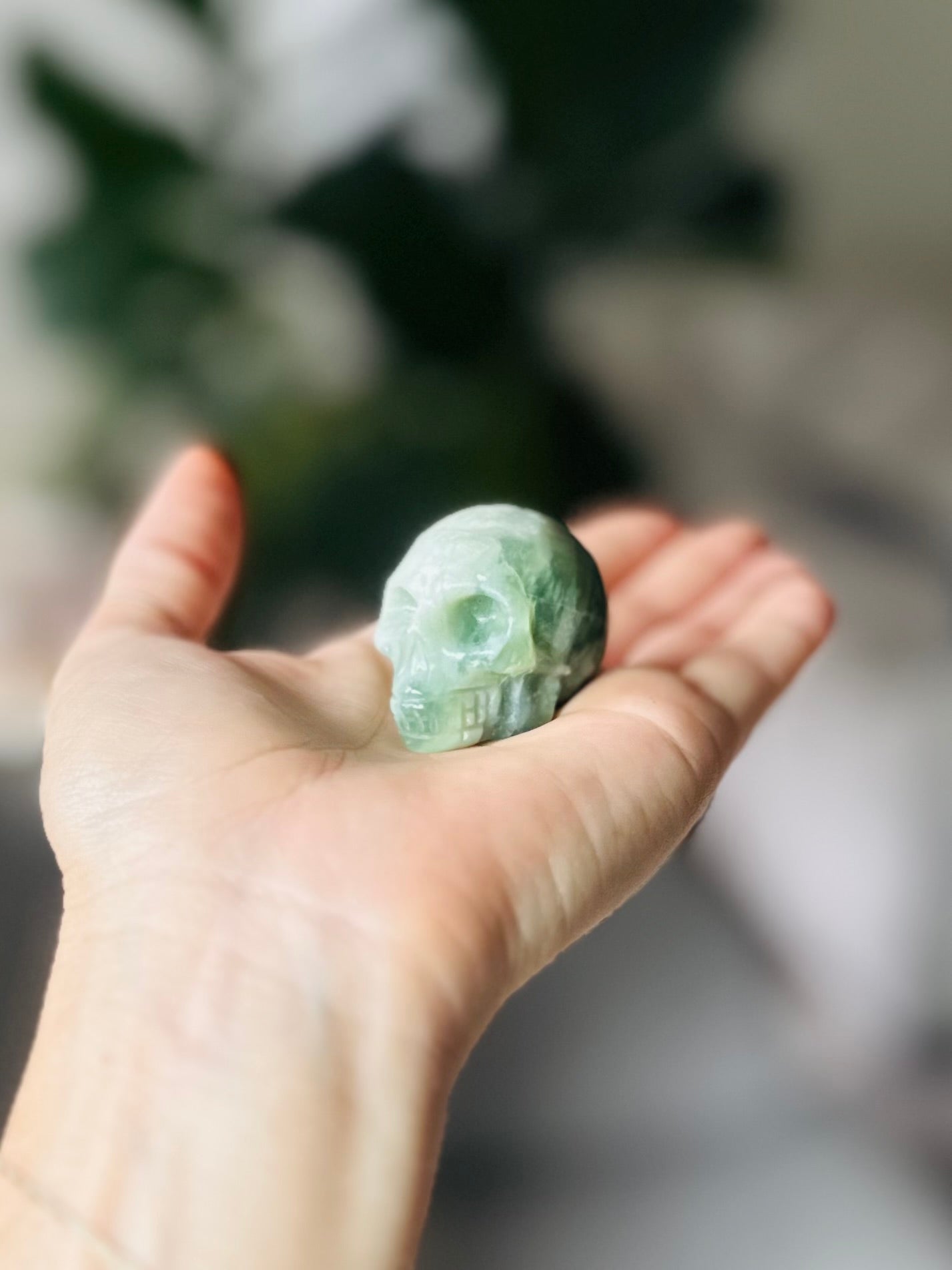 jade crystal skull for balance and harmony, attracts luck and fosters inner peace and well-being with gentle green hues