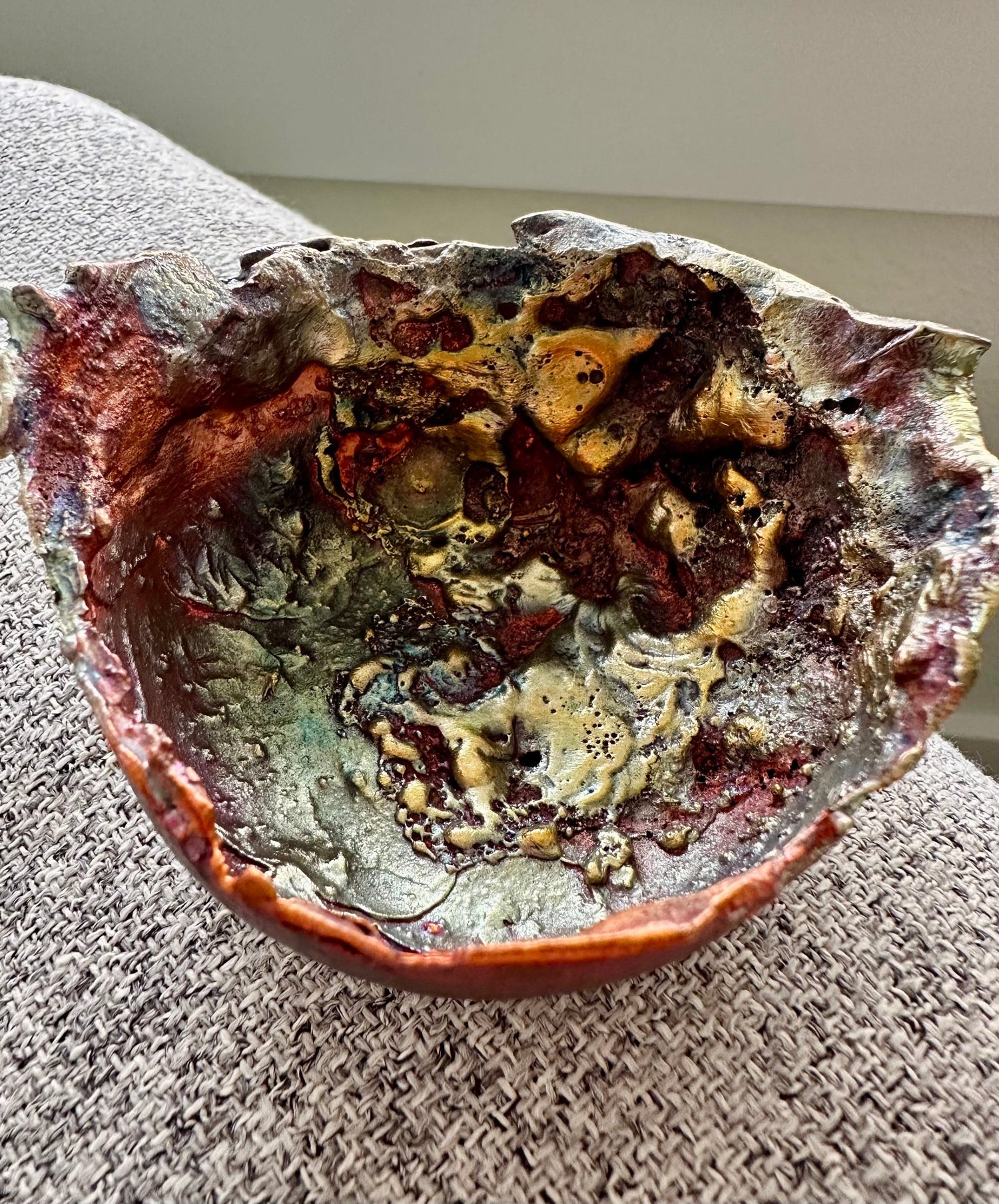 Close-up of copper bowl rim showing unique form and depth