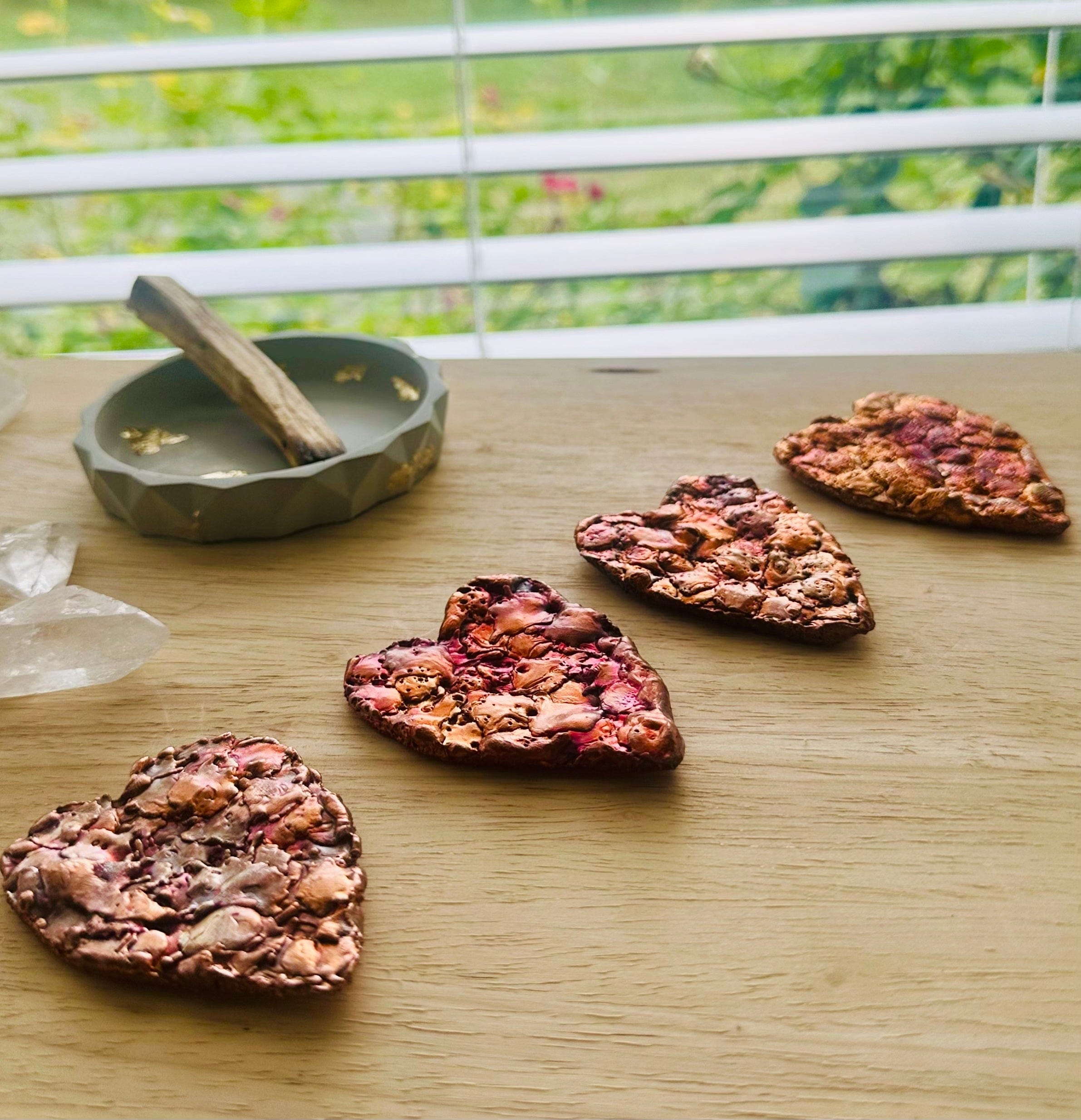 Stacked Arizona Copper Hearts showing variation in shape and tone