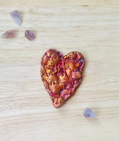 Close-up of raw copper texture and natural splash pattern on heart