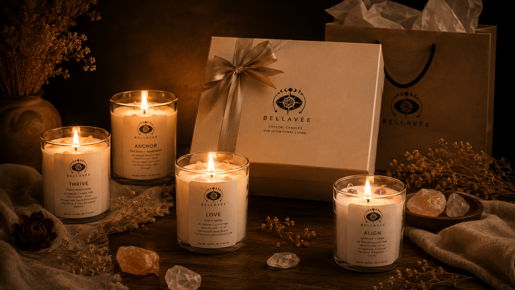BellaVee crystal candle gift set with Thrive Anchor Love and Align candles lit surrounded by crystals and branded gift box Austin Texas